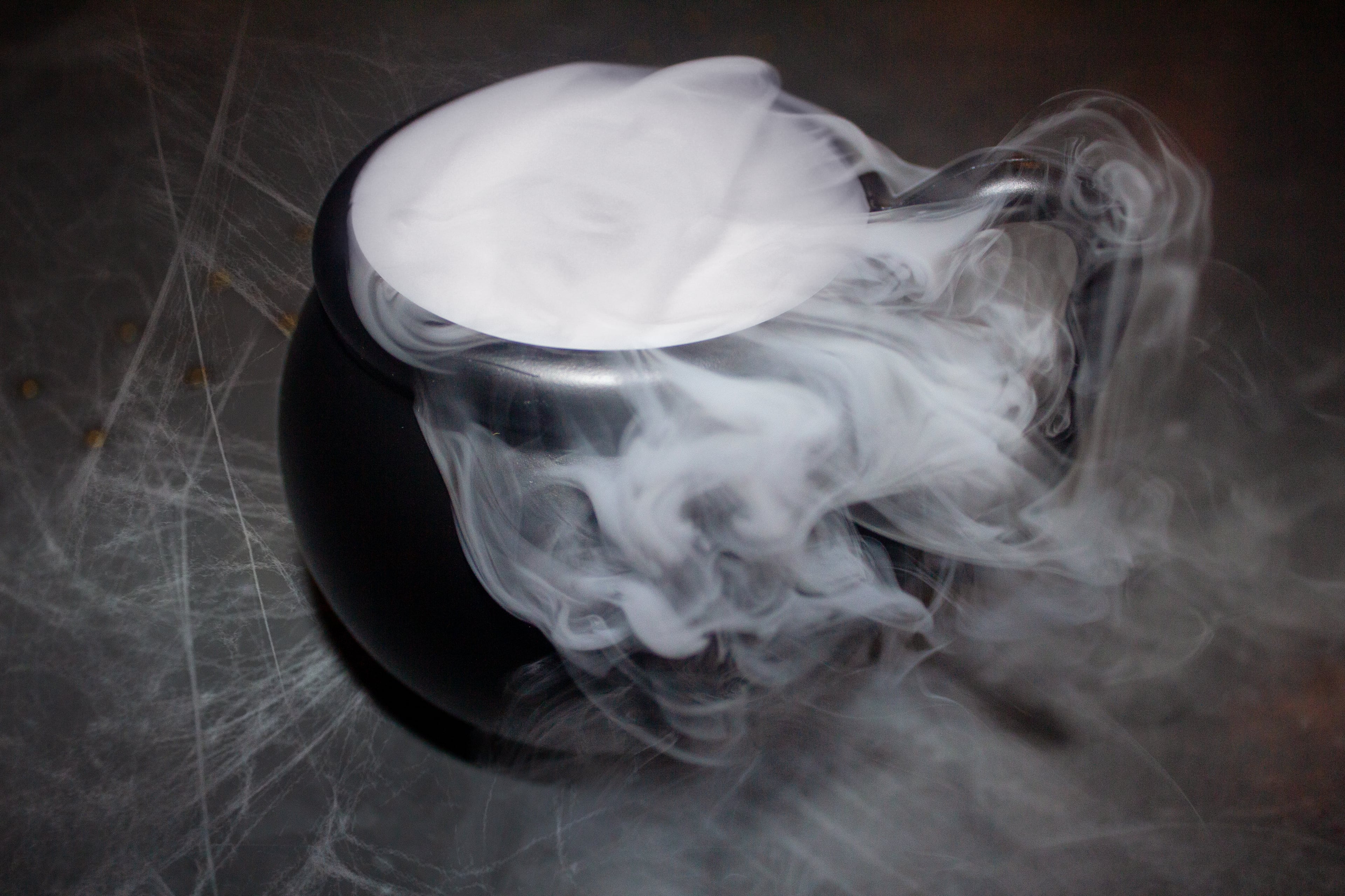 A witchy brew of rum, blue curacao, pineapple juice and citrus soda bubbles comes in a mini cauldron surrounded by the foggy effect of dry ice in The Select's hex on the Beach cocktail. (Courtesy of The Select)