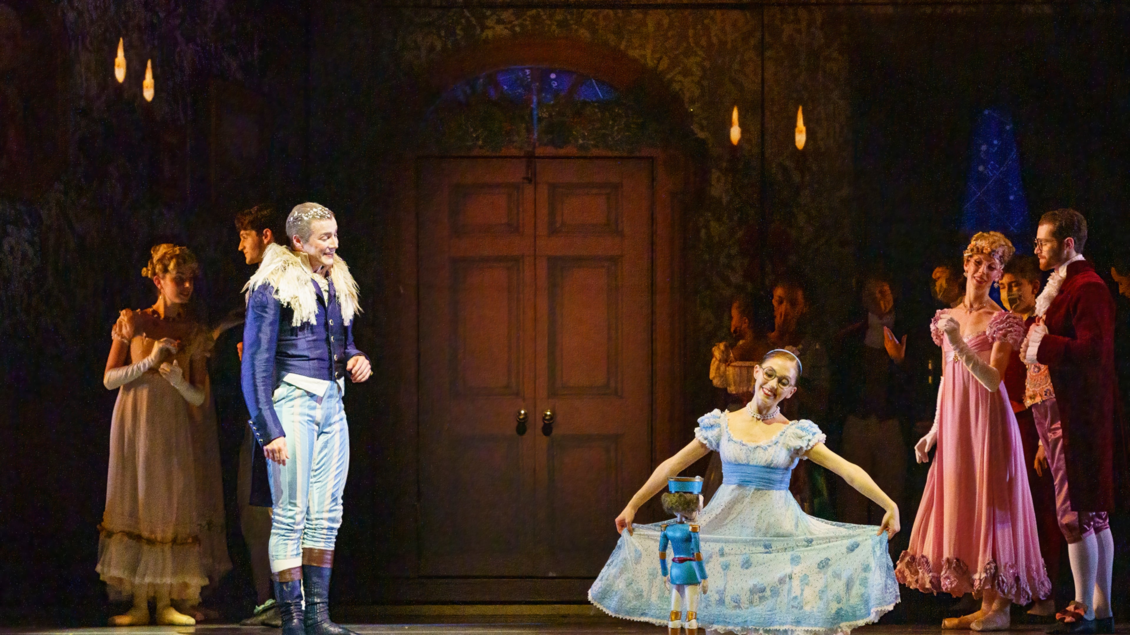 Drosselmeier (Jacob Bush) looks on as Marie (Kaitlin Roemer) dances with her Nutcracker.