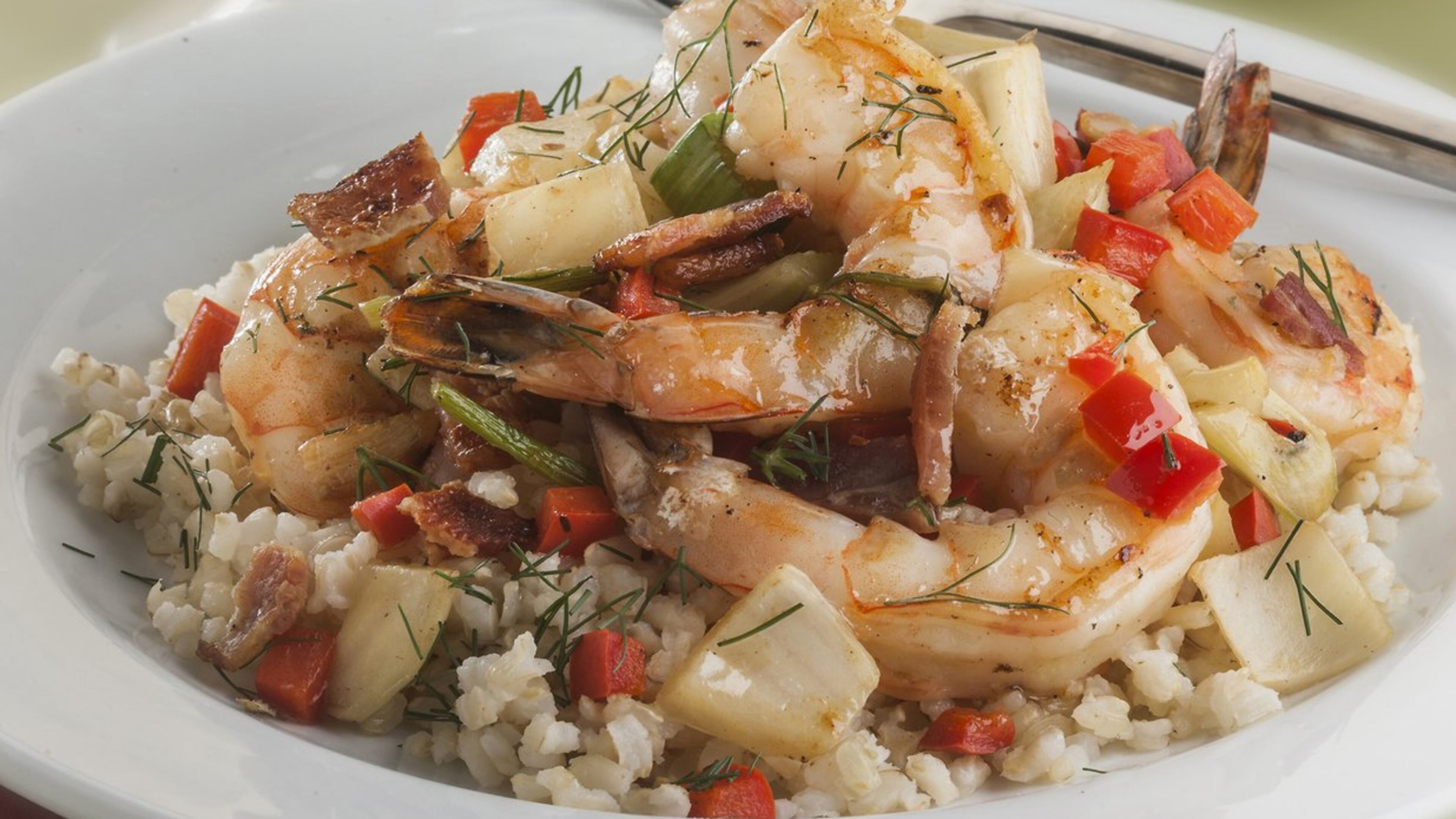 Shrimp fried in bacon fat and served over rice with veggies is the perfect meal to drink with white wine - if you find one with some weight to it. (Bill Hogan/Chicago Tribune/TNS)