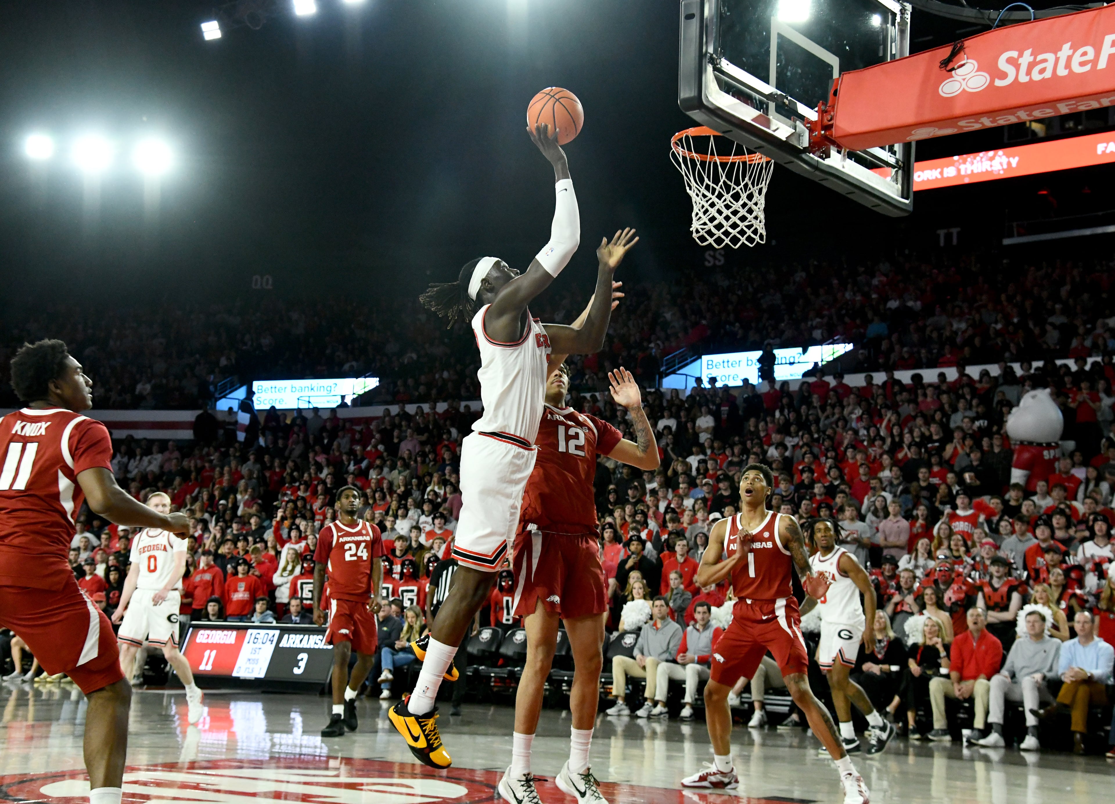 Georgia center Somto Cyril shoots over Arkansas forward Malique Ewin during the first half in an NCAA college basketball game at Stegeman Coliseum, Saturday, Jan. 17, 2026, in Athens. (Hyosub Shin/AJC)