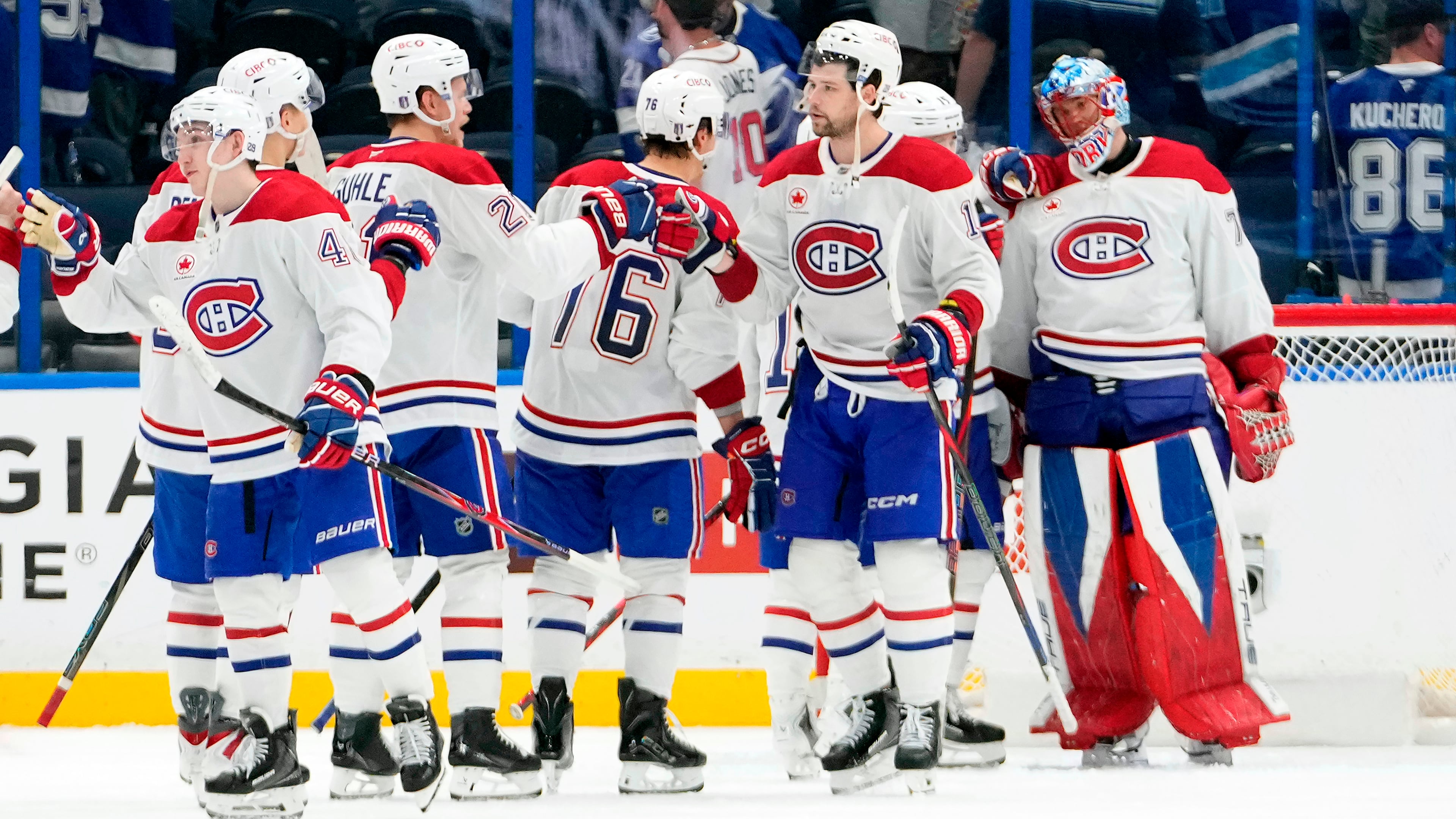 Montréal Canadiens players celebrate their win over the Tampa Bay Lightning in Game 5 of an NHL hockey Stanley Cup first-round playoff series, Wednesday, April 29, 2026, in Tampa, Fla. (AP Photo/Chris O'Meara)