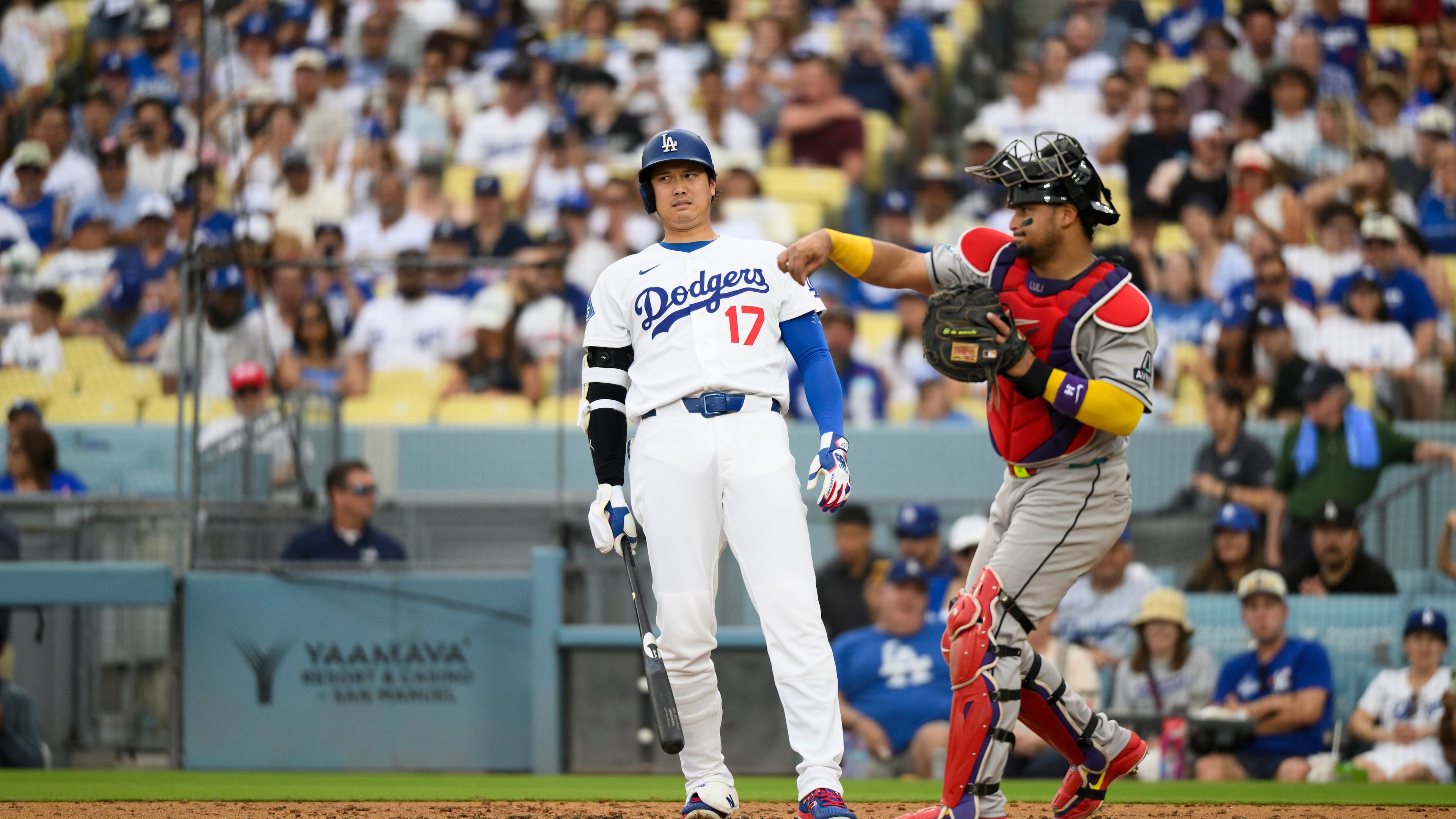 Los Angeles Dodgers' Shohei Ohtani (17) reacts as Arizona Diamondbacks catcher Gabriel Moreno throws during the third inning of a baseball game in Los Angeles, Sunday, July 12, 2026. (AP Photo/Kyusung Gong)