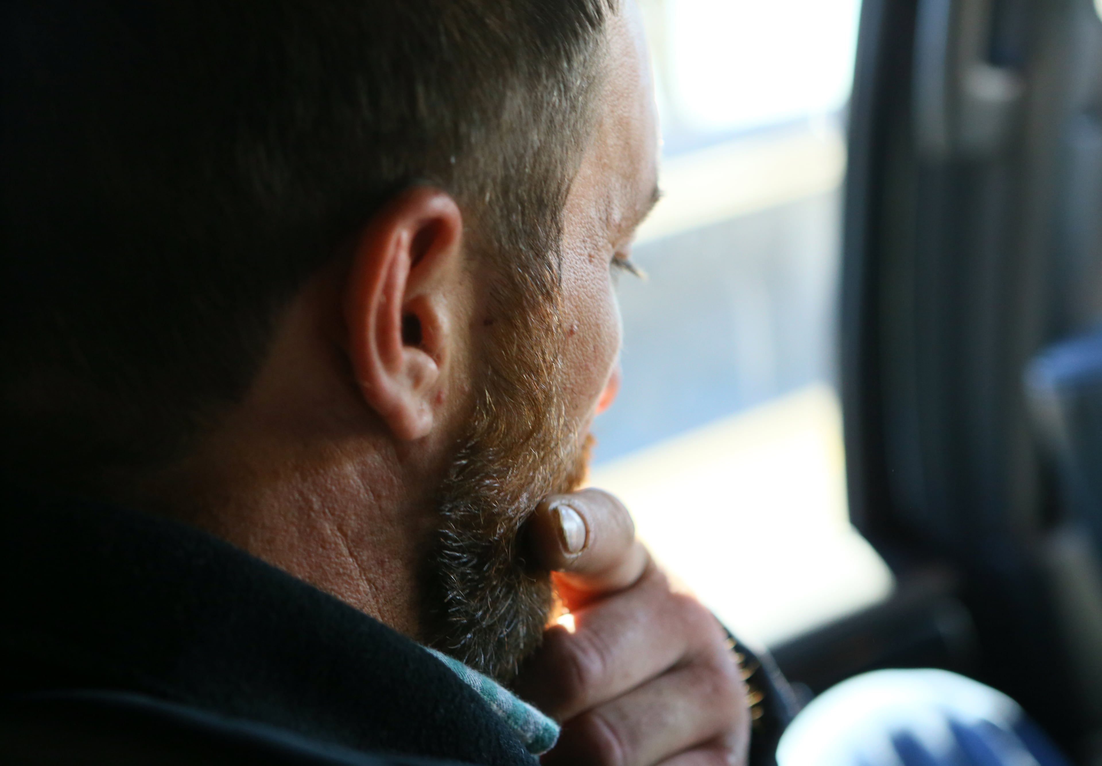 Joel Hartman pauses to gather his thoughts on the drive to Hartsfield-Jackson International Airport to be reunited with his family for Thanksgiving on Nov. 28, 2013, in Atlanta.