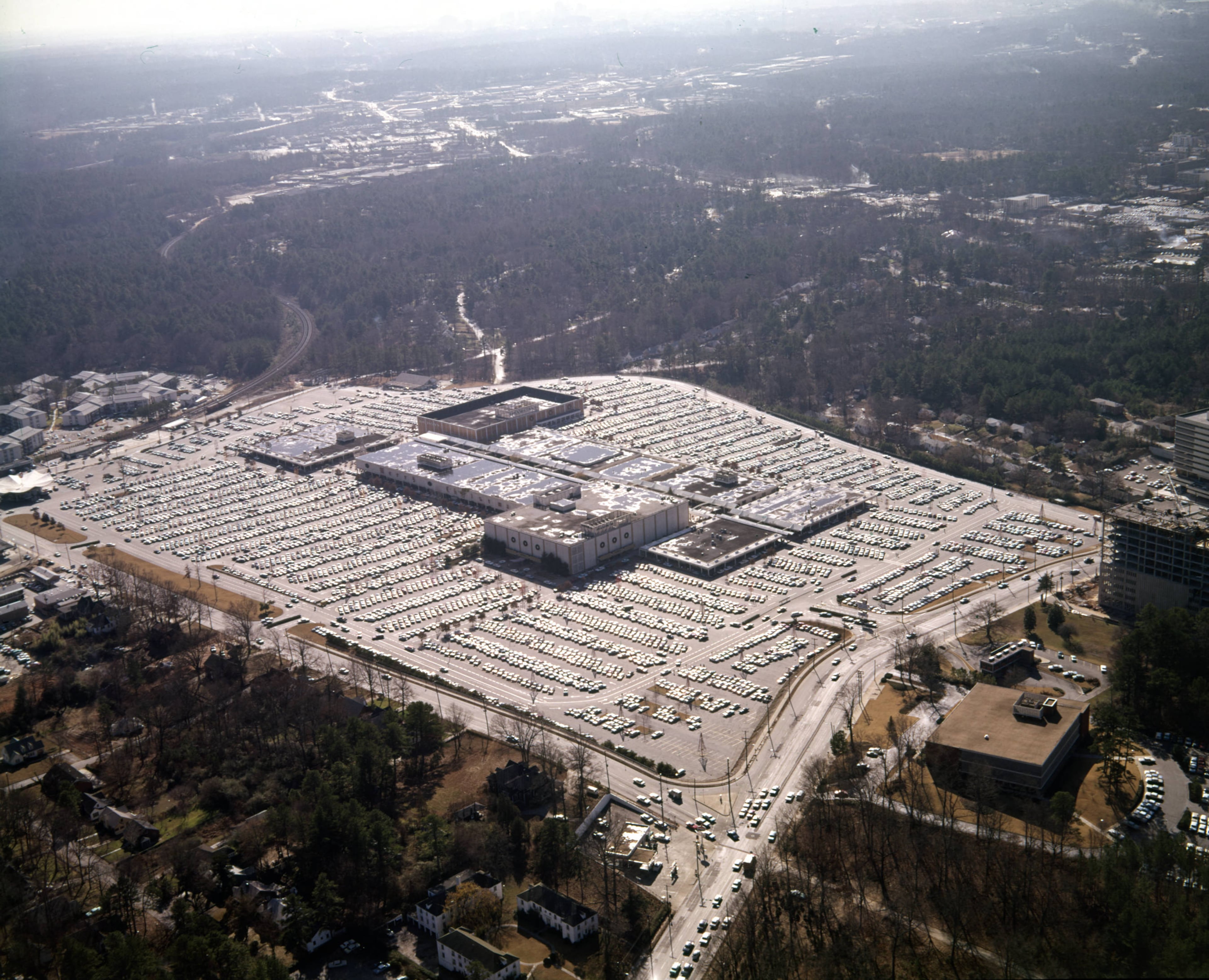 Aerial view of Lenox Square and its surrounding parking lot, looking south, Buckhead, Atlanta, Georgia, December 21, 1965.