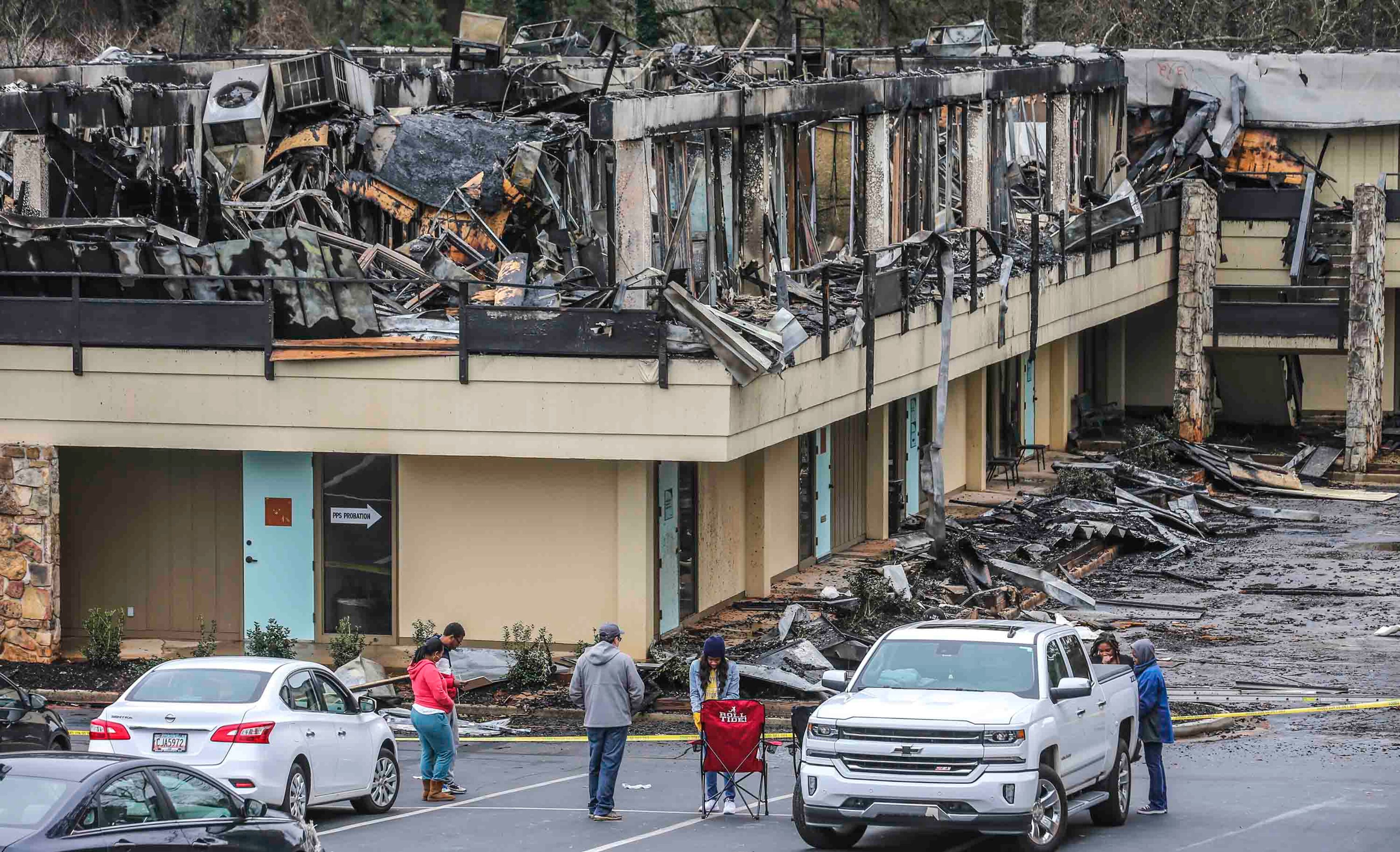 February 15, 2019 DeKalb County:
Some building tenants gathered on Friday, Feb. 15, 2019 to greet clients outside The Kensington office park building that burned on Thursday. Firefighters battled the blaze at the office complex in DeKalb County on Thursday afternoon, authorities said. DeKalb County Fire Capt. Dion Bentley told AJC the building was evacuated and no one was hurt. The Kensington office park, which is located at 4151 Memorial Drive at the intersection of Covington Highway near Avondale Estates, was built in 1974. Bentley said the complexâÃôs metal roof acted like a shield, making it difficult for firefighters to spray water on top of the fire. He also said it was too dangerous for firefighters to enter the building at first. âÃúThe metal roof is making it rough, and itâÃôs acting like an umbrella,âÃù he said earlier. âÃúItâÃôs an ugly, nasty fire.âÃù Crews have since put out most of the large flames and been able to enter the building to finish extinguishing hot spots. The cause of the fire is unknown, but it started on the second floor, Channel 2 Action News reported. The building is totaled, destroying many tenantsâÃô businesses. The National Weather Service said the smoke plume was thick enough to be visible on weather radar systems. JOHN SPINK/JSPINK@AJC.COM