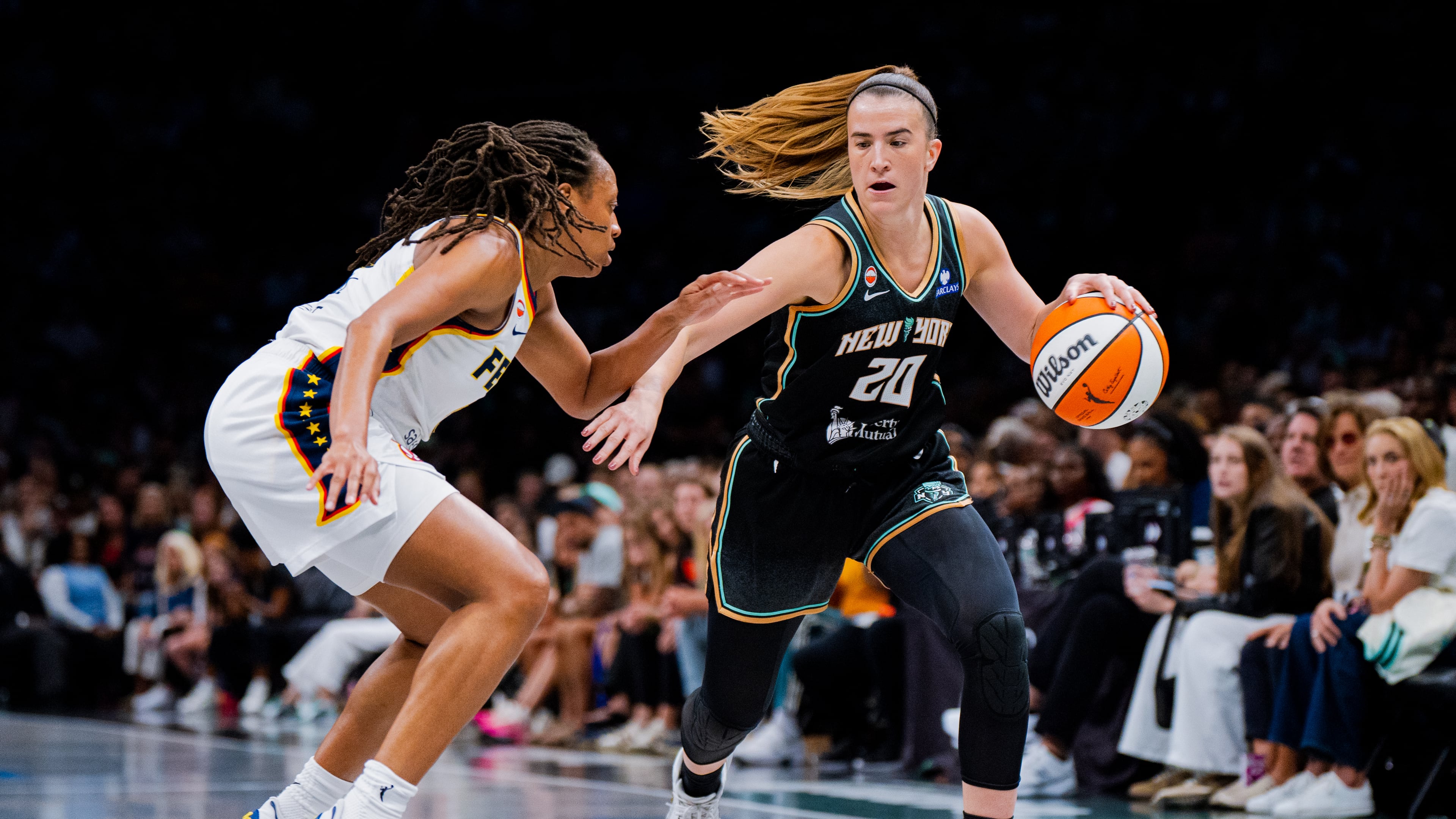 New York Liberty guard Sabrina Ionescu (20) dribbles toward the basket during the first half of a WNBA basketball game against the Indiana Fever, Saturday, Aug. 22, 2026, in New York. (AP Photo/Angelina Katsanis)