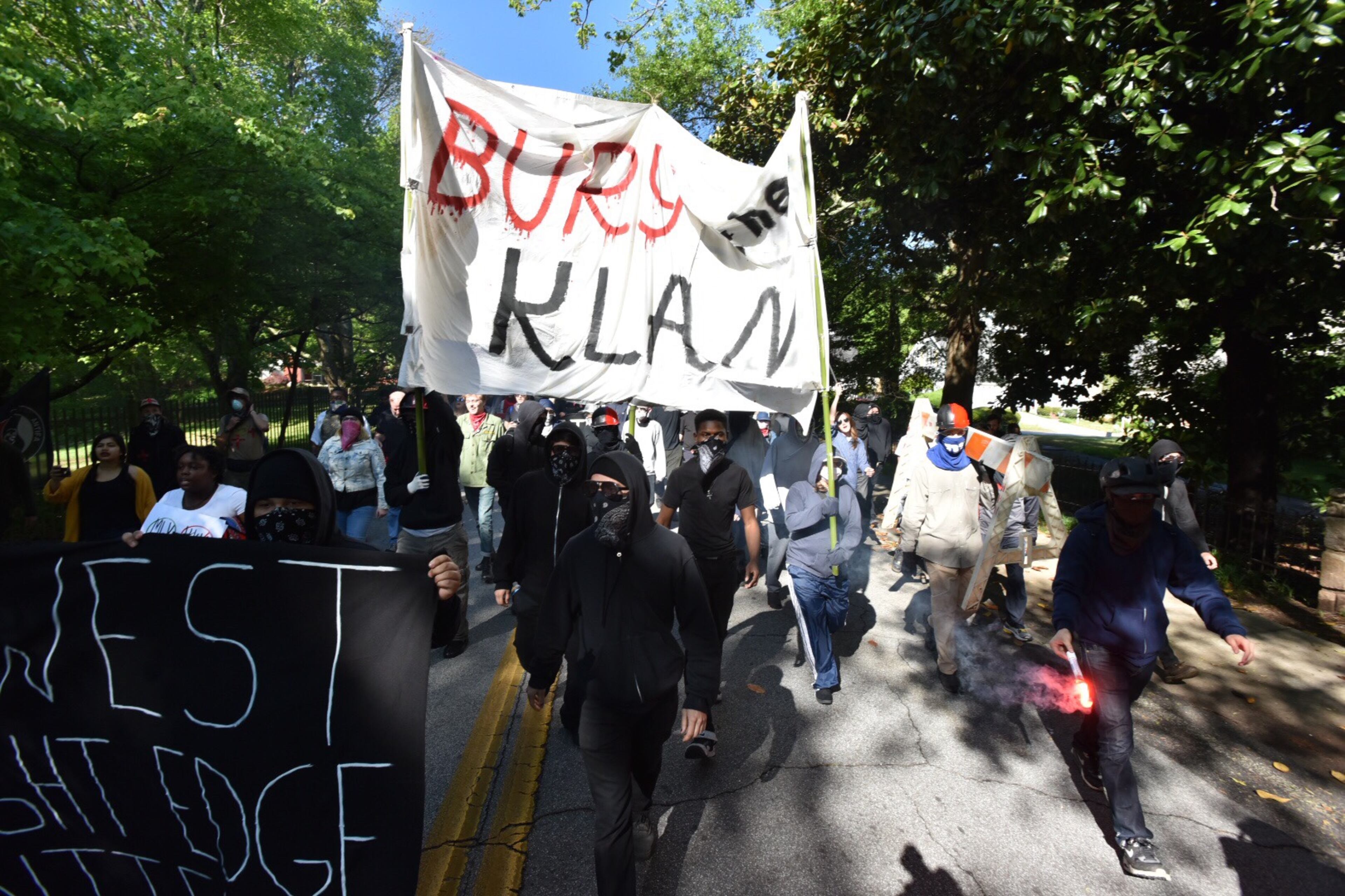 Protesters clash with police near a “white power” rally in Stone Mountain on Saturday, April 23, 2016. The protesters said they are opposing the message of hate at the supremacist rally also taking place at the park.