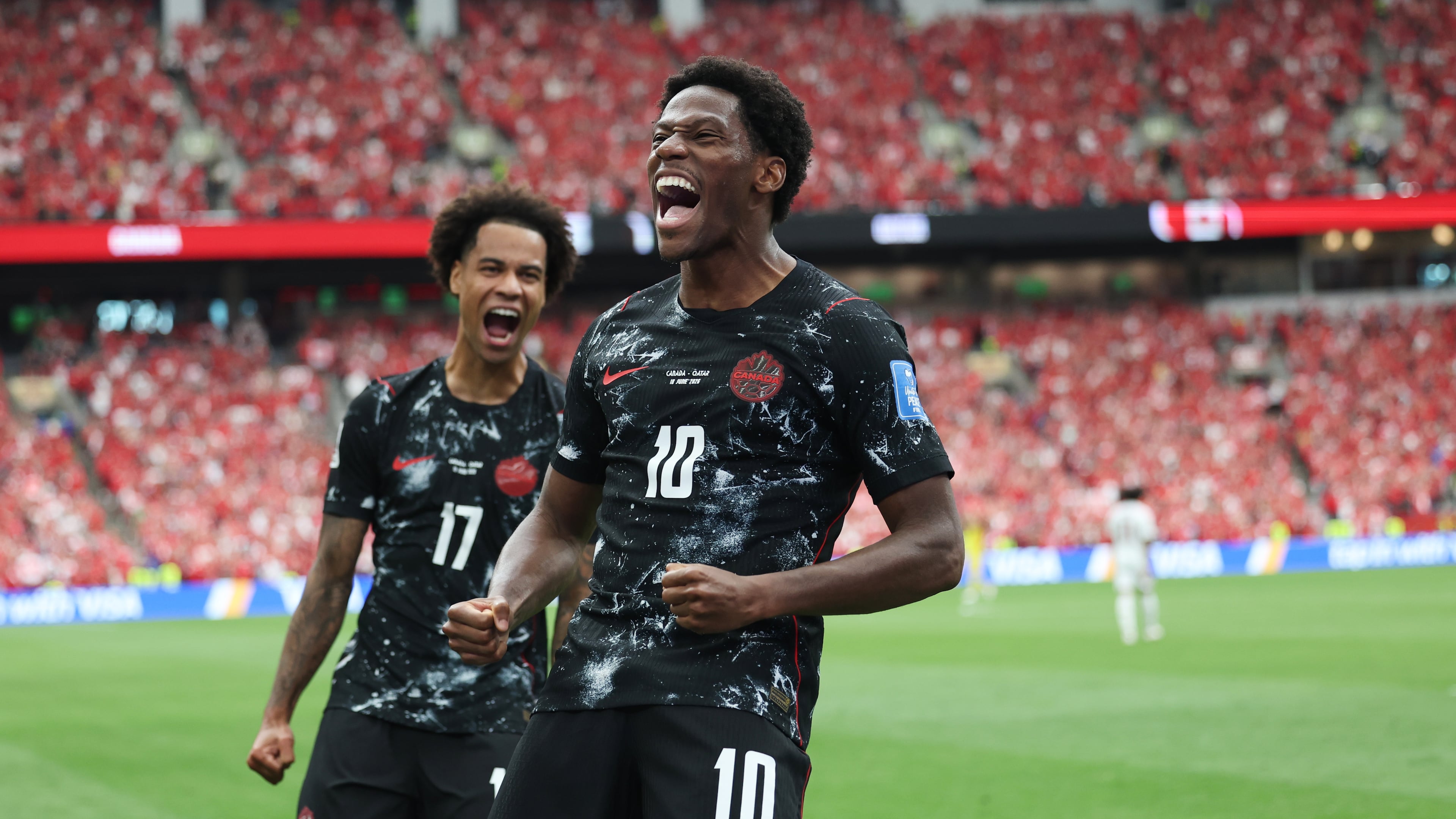 Canada's Jonathan David (10) celebrates after scoring their second goal during the World Cup Group B soccer match between Canada and Qatar in Vancouver, British Columbia, Thursday, June 18, 2026. (AP Photo/Emma Peterson)