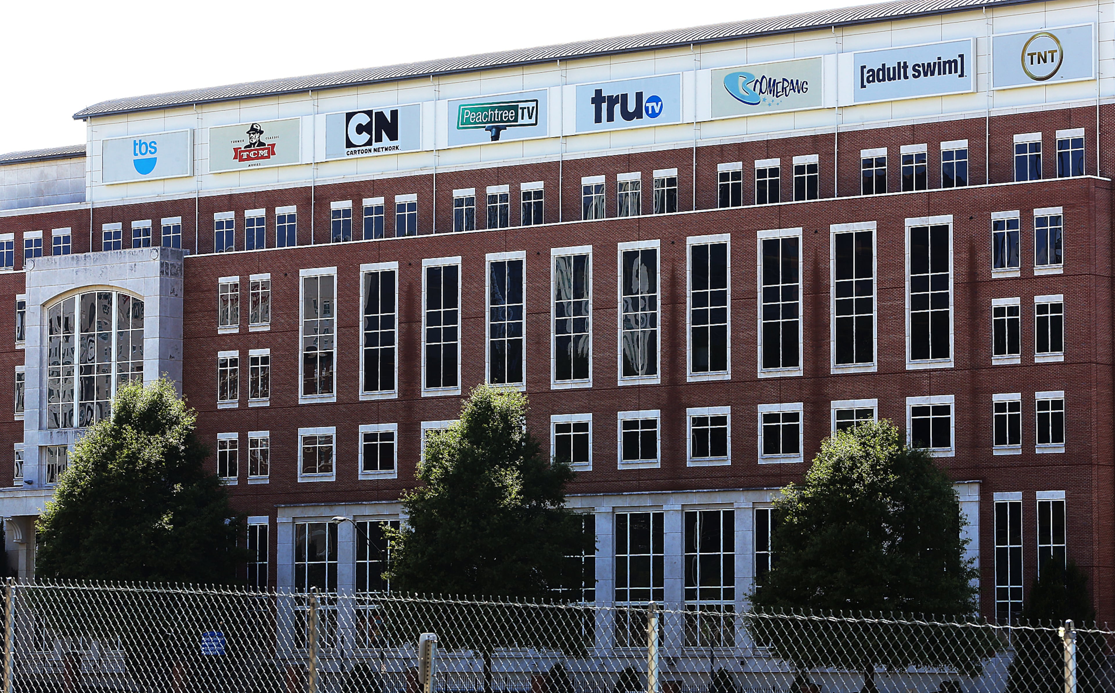 Turner Broadcasting, headquartered in Atlanta, is part of the $85 billion acquisition that was ruled on Tuesday.