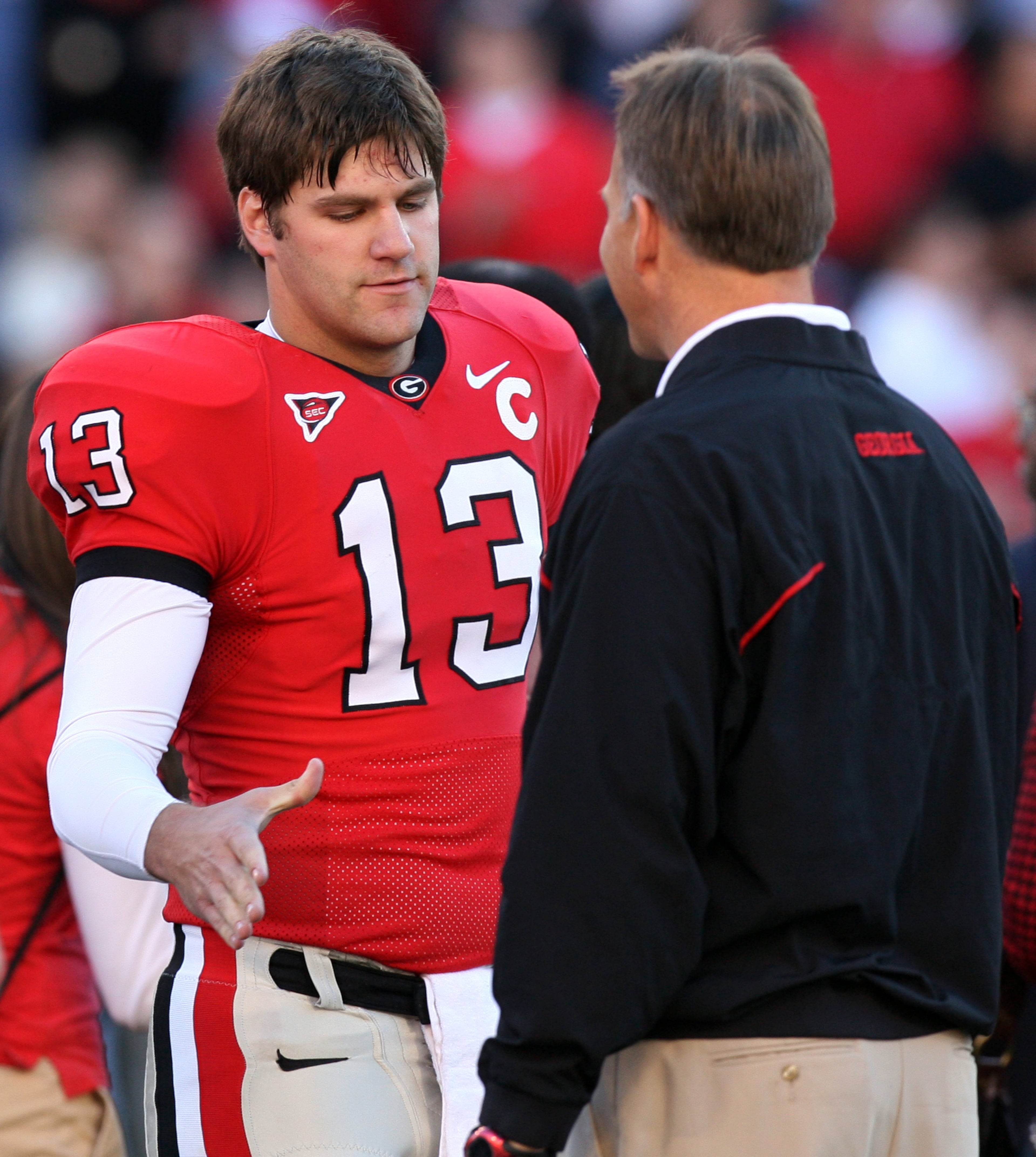 UGA senior quarterback Joe Tereshinski III (left) shakes his coach's hand prior to the kickoff of the Georgia-Georgia Tech game in 2006. (Curtis Compton / AJC staff