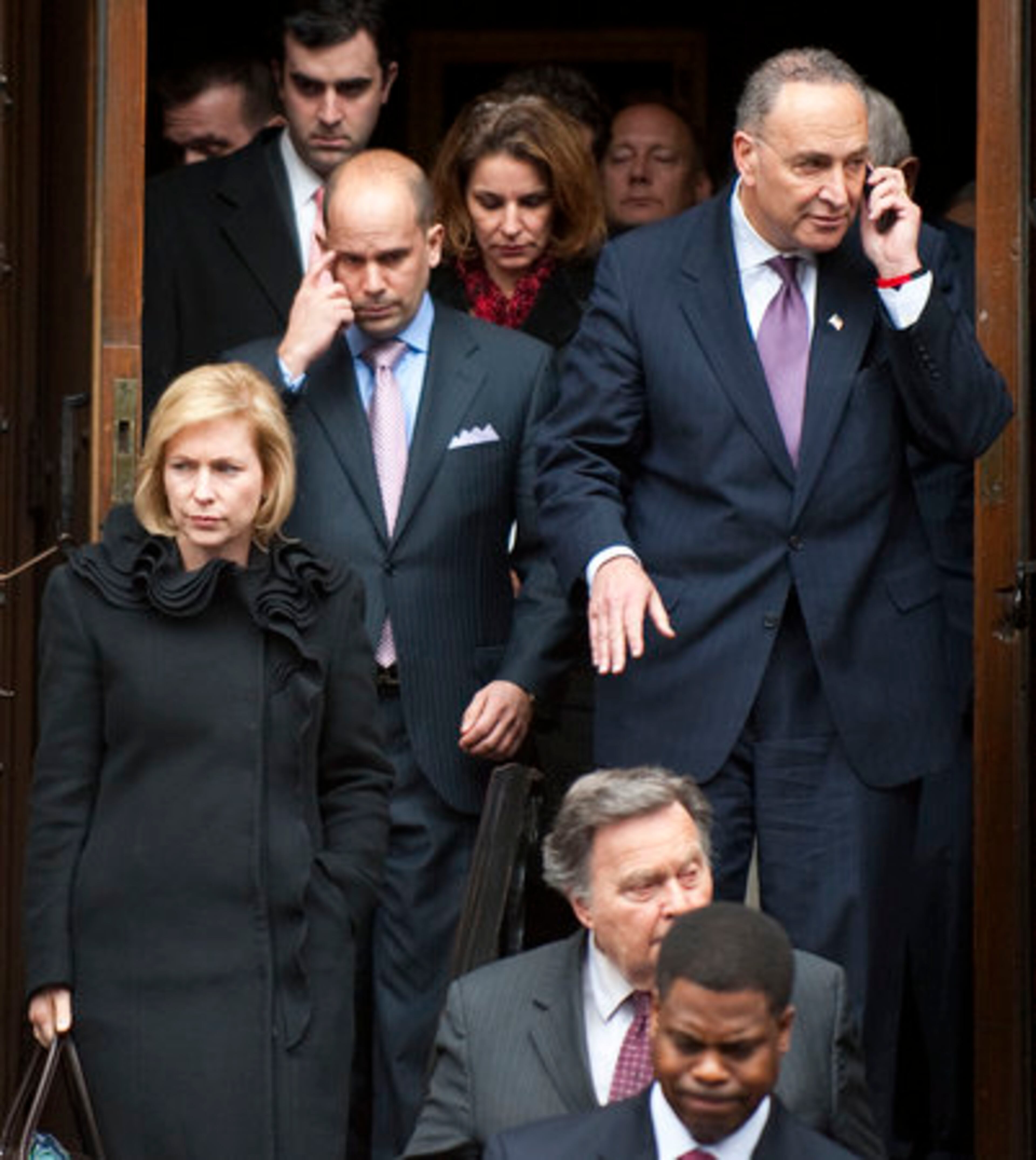 New York Senators Kirsten Gillibrand (left) and Chuck Schumer (right) leave the Church of Saint Vincent Ferrer in New York after attending the funeral mass of former vice presidential candidate Geraldine Ferraro.