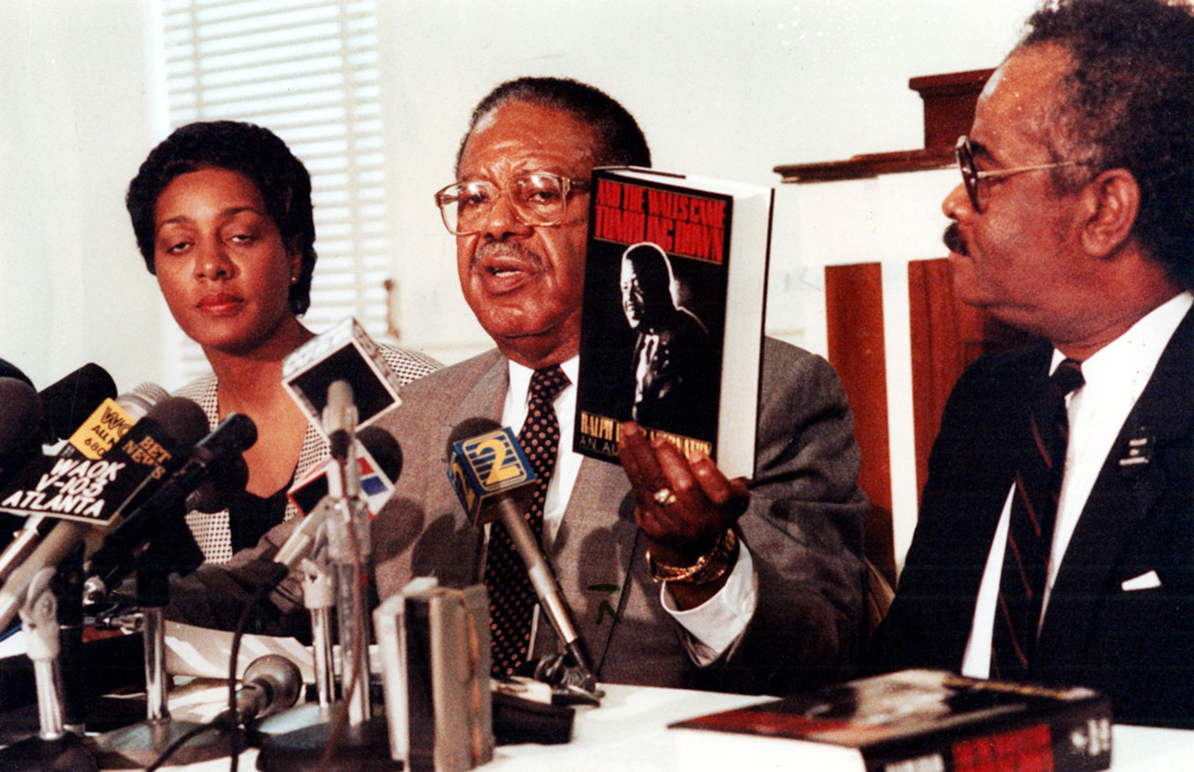 1989: Abernathy, with Tyrone Brooks and administrative assistant Phyllis Marks, addresses criticism of his autobiography "And the Walls Came Tumbling Down." One part of the book described incidents of infidelity on Martin Luther King Jr.'s last night alive. Abernathy was condemned by several former allies over the content of the book. He died months later. (JOHN SPINK / AJC file)