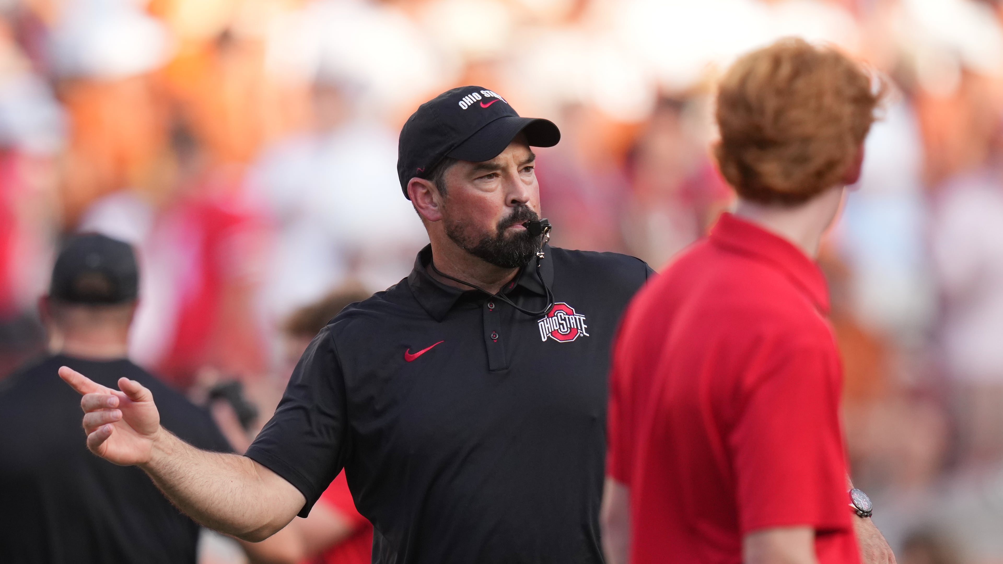 Ohio State head coach Ryan Day watches players warm up before an NCAA college football game against Texas in Austin, Texas, Saturday, Sept. 12, 2026. (AP Photo/Eric Gay)