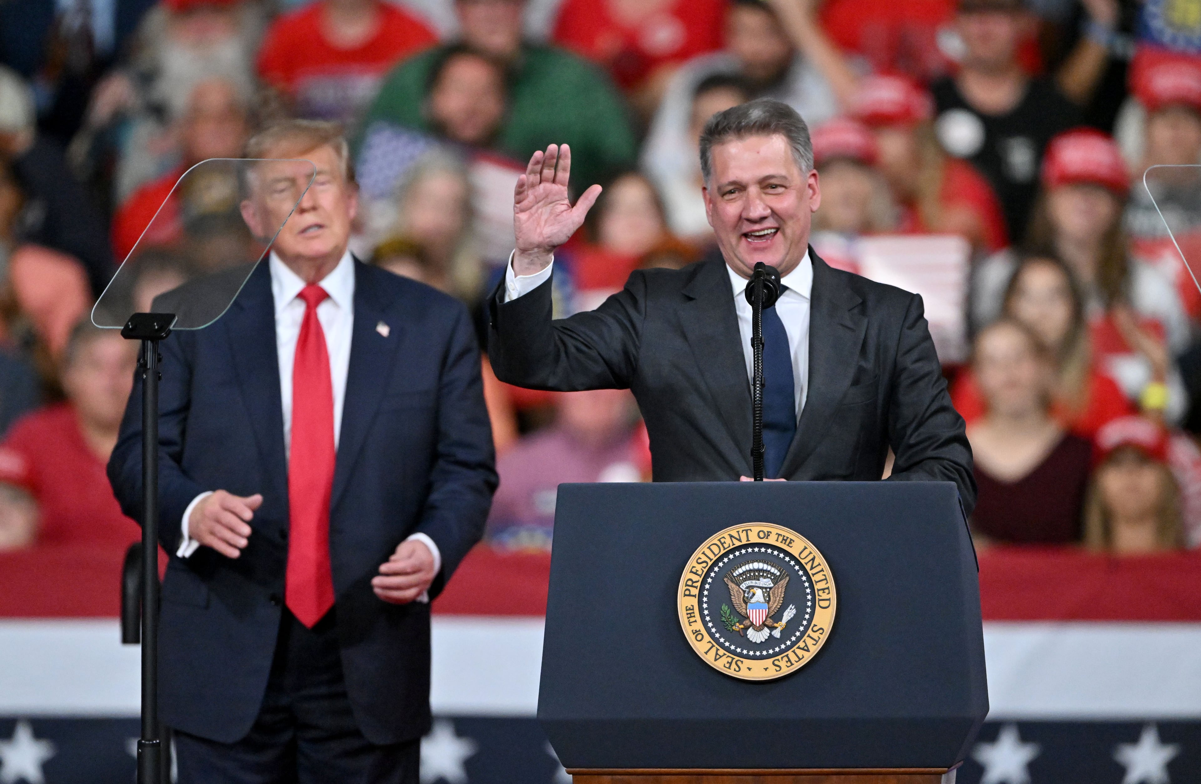 Gernot Döllner (right), CEO of Audi AG, speaks as President Donald Trump stands besides him during a midterm campaign rally at Guardian Centers on Saturday, Oct. 24, 2026, in Perry. (Hyosub Shin/AJC)