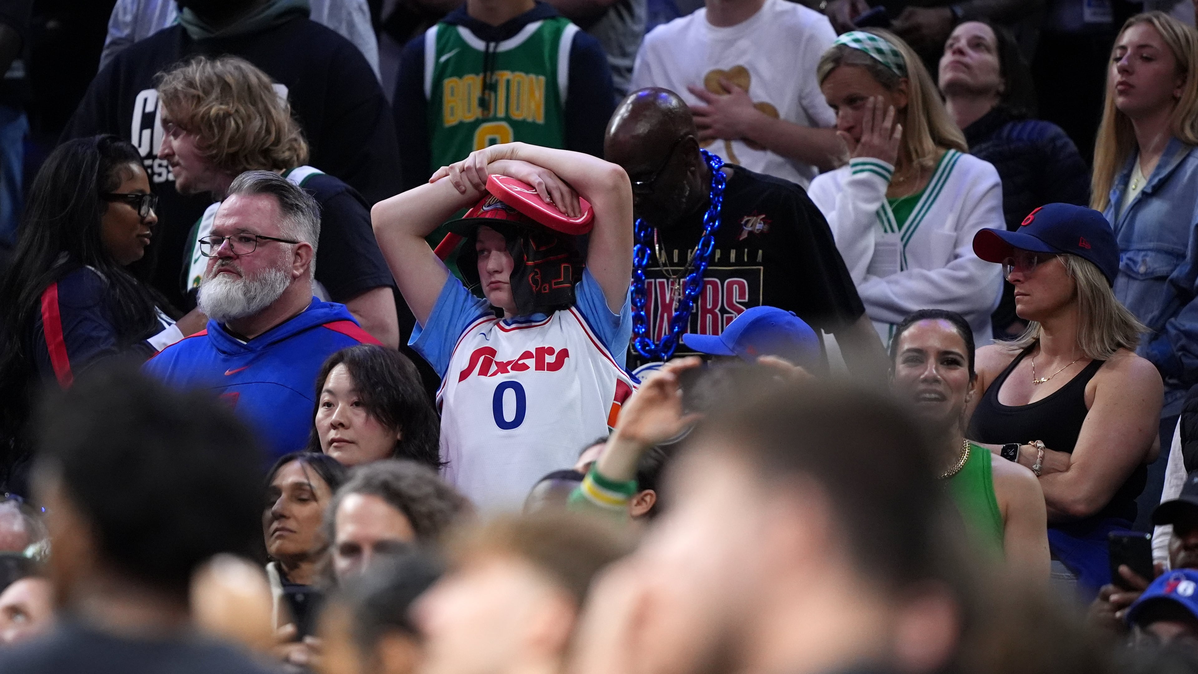 A Philadelphia 76ers' fan reacts during final minute of Game 3 against the Boston Celtics in a first-round NBA playoffs basketball series Friday, April 24, 2026, in Philadelphia. (AP Photo/Matt Slocum)