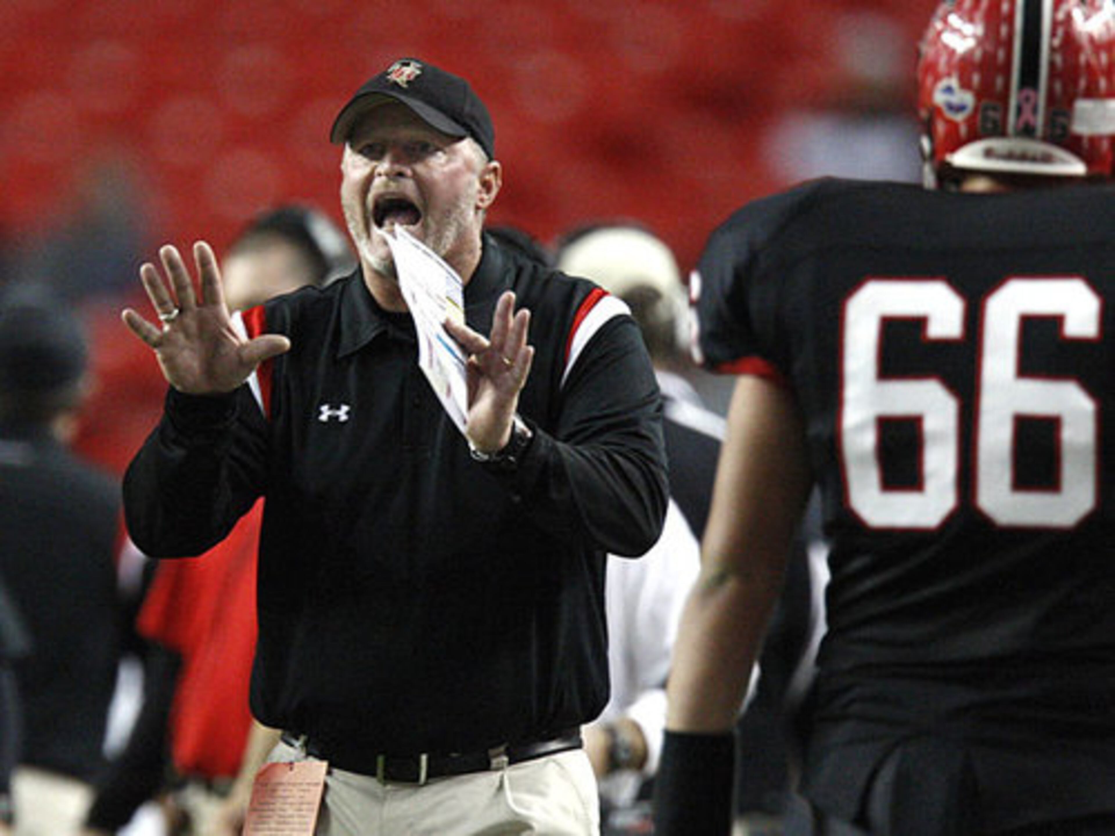 Flowery Branch coach Lee Shaw gives instructions during the first half.