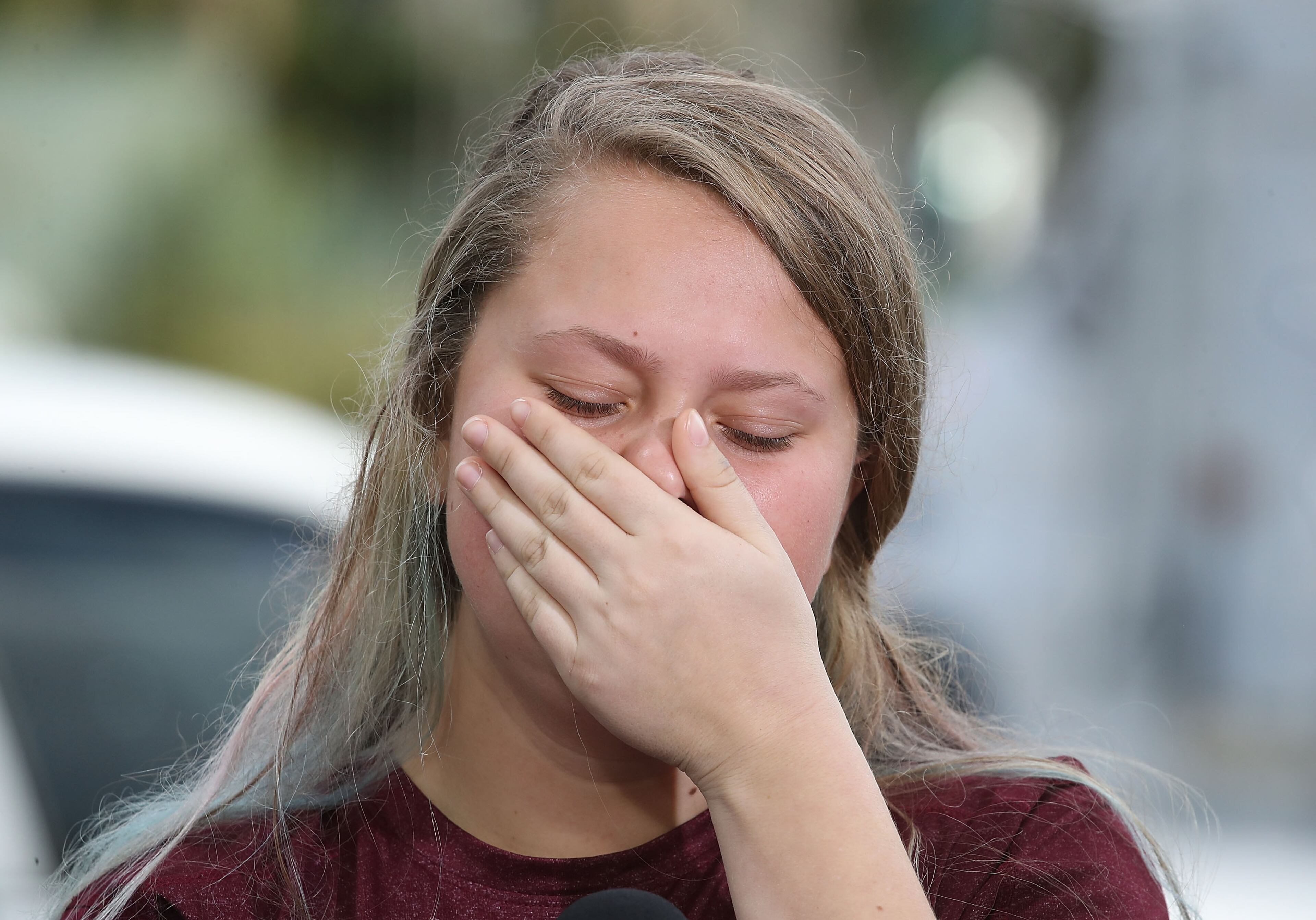 PARKLAND, FL - FEBRUARY 15: Student Kelsey Friend, becomes emotional while recounting her story about yesterday's mass shooting at the Marjory Stoneman Douglas High School where 17 people were killed, on February 15, 2018 in Parkland, Florida. Police arrested the suspect after a short manhunt, and have identified him as 19 year old former student Nikolas Cruz. (Photo by Mark Wilson/Getty Images)