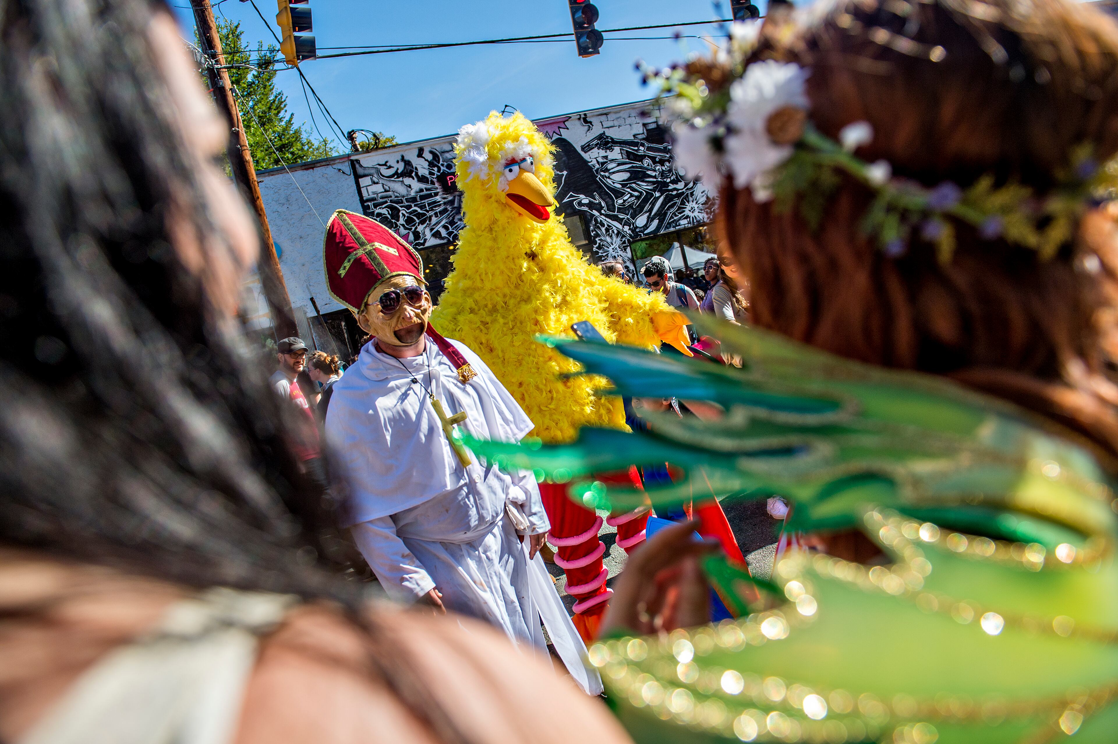 October 17, 2015 Atlanta - Dressed as the pope, Joey Lewis, has his photo taken with Jason Dodds as Big Bird before the start of the Little Five Points Halloween Parade in Atlanta on Saturday, October 17, 2015. The annual parade brought out tens of thousands of people to watch the antics. JONATHAN PHILLIPS / SPECIAL