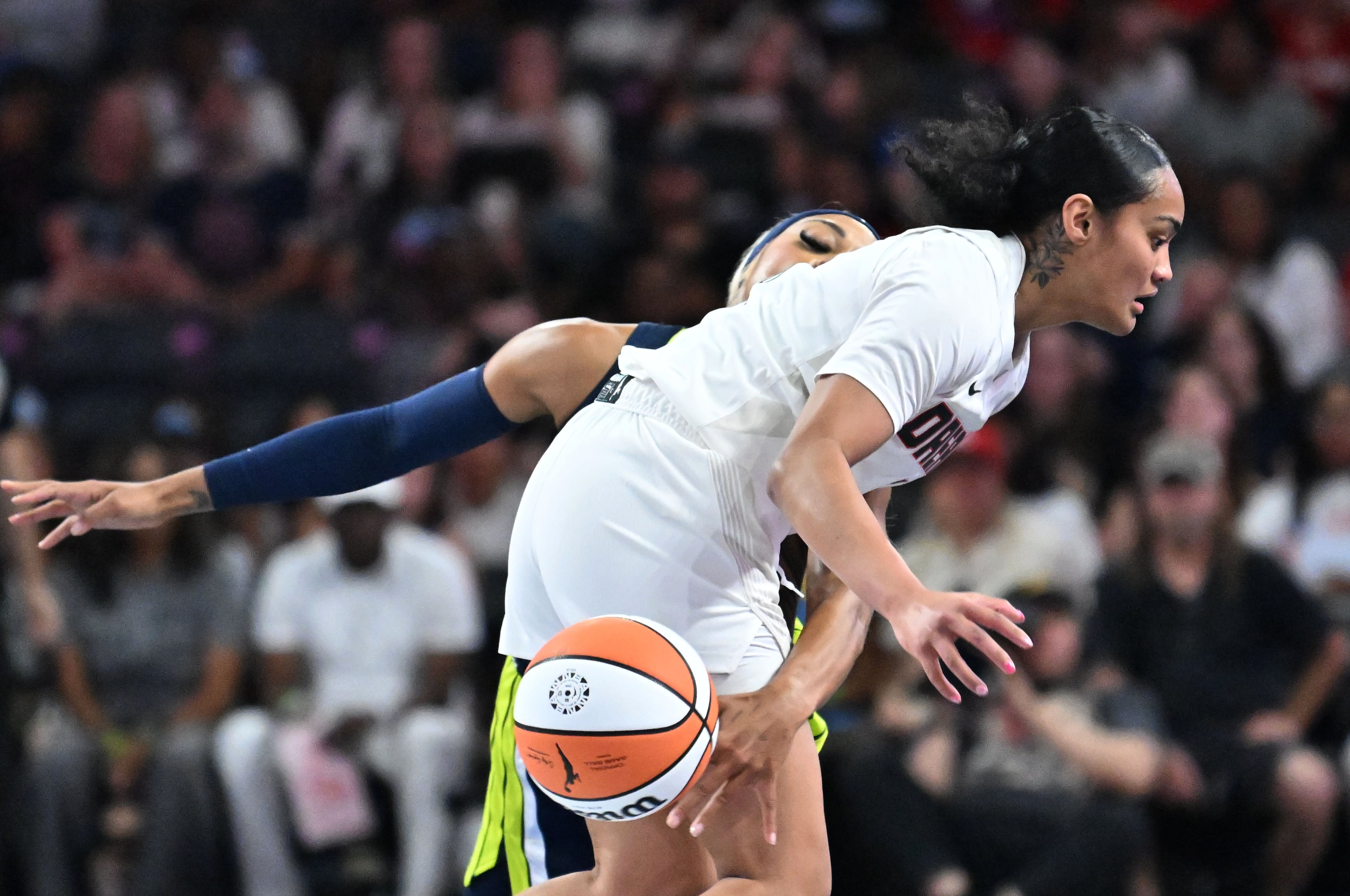 Dallas Wings guard DiJonai Carrington (21) steals a ball from Atlanta Dream guard Te-Hina Paopao (2) during the first half in a WNBA basketball game at Gateway Center Arena, Saturday, May 24, 2025, in Atlanta. (Hyosub Shin / AJC)