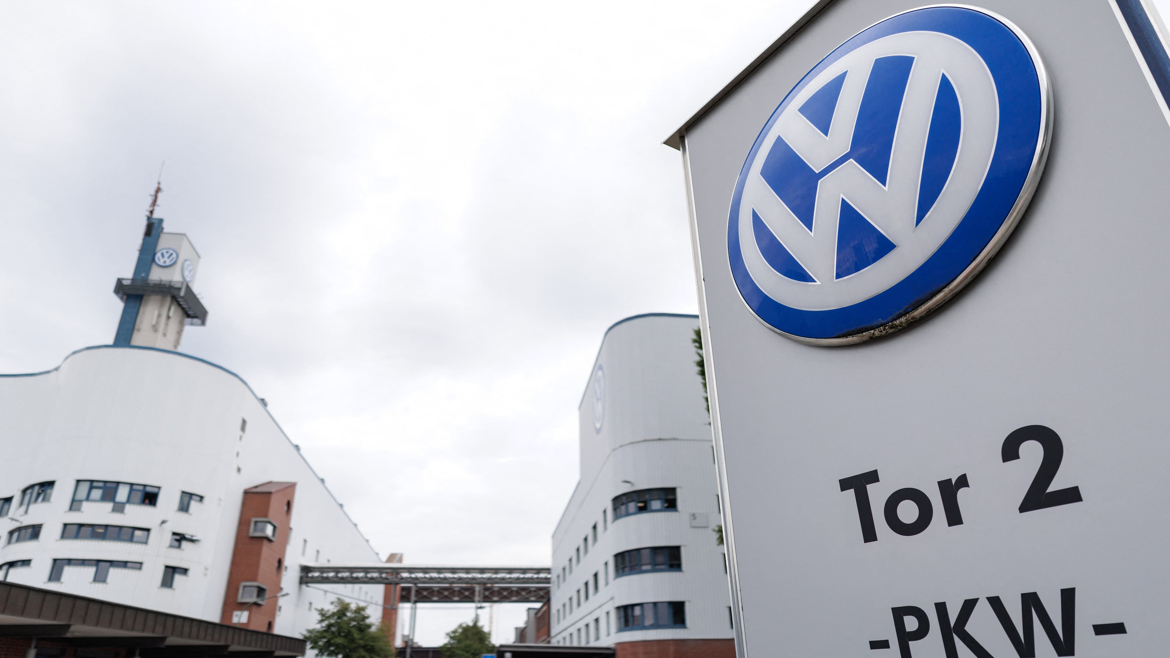 The VW logo in front of the Volkswagen plant in Osnabrueck, Germany, Wednesday, Aug. 26, 2026. (David Ebener/dpa via AP)