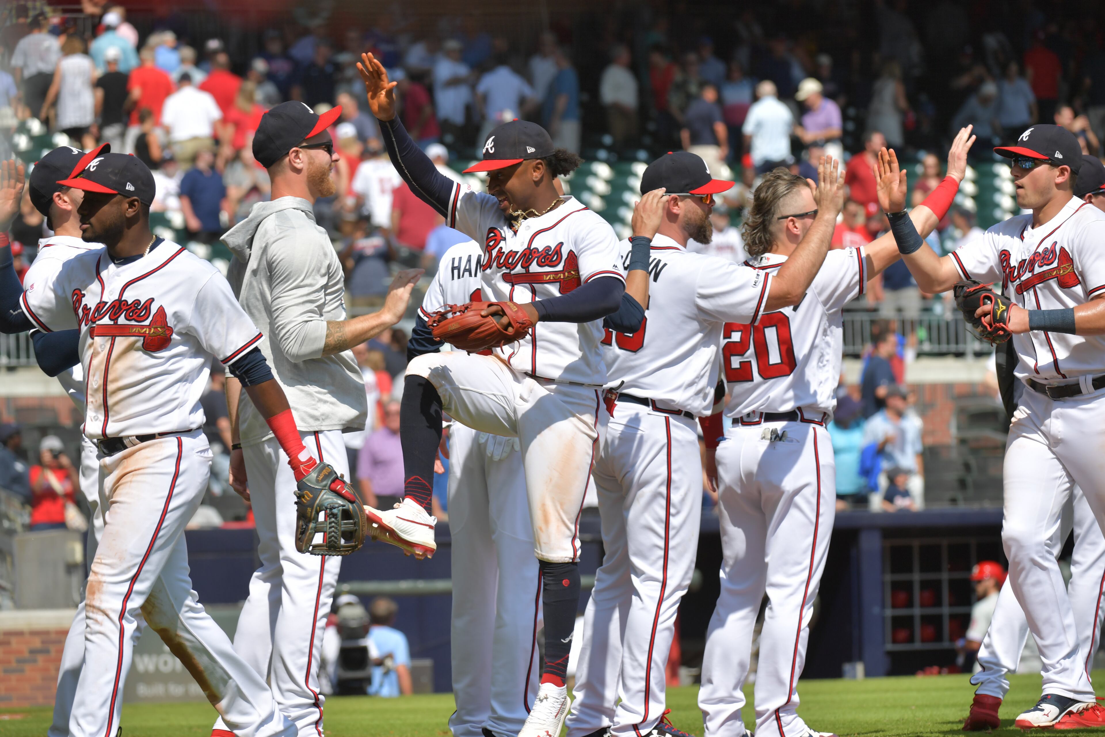 Braves players celebrate their win 5-4 over the the Philadelphia Phillies on Thursday. (Hyosub Shin / Hyosub.Shin@ajc.com)