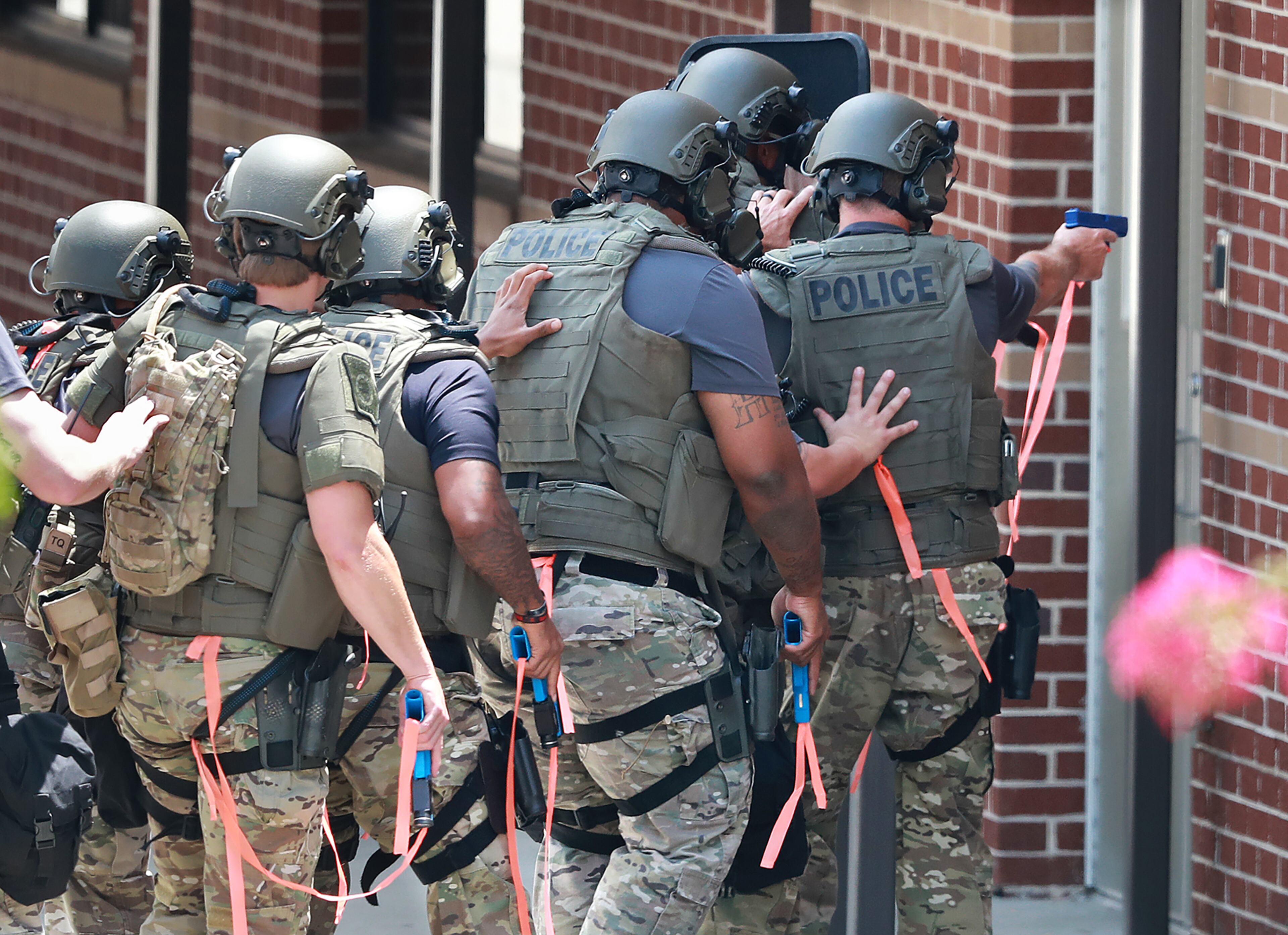 July 25, 2018 Winston: A SWAT team enters Mason Creek Middle School during an active shooter training exercise held by the Douglas County Sheriff's Office on Wednesday, July 25, 2018, in Winston. The large scale training drill is meant to test the resources of area law enforcement and emergency responders in an effort to better prepare Douglas County First Responders in the event of a mass casualty active shooter event. Curtis Compton/ccompton@ajc.com