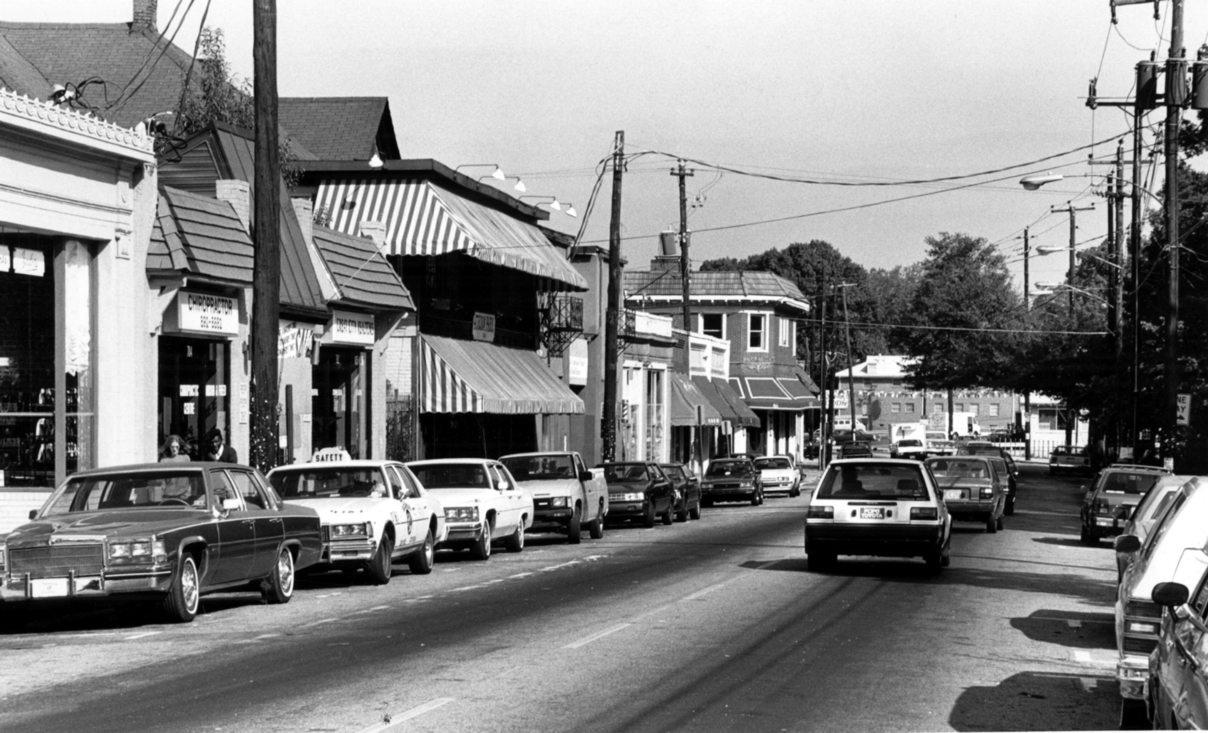 The original caption from 1987: "Shops and restaurants with a community atmosphere have sprung up along North Highland Avenue south of Virginia Avenue."
