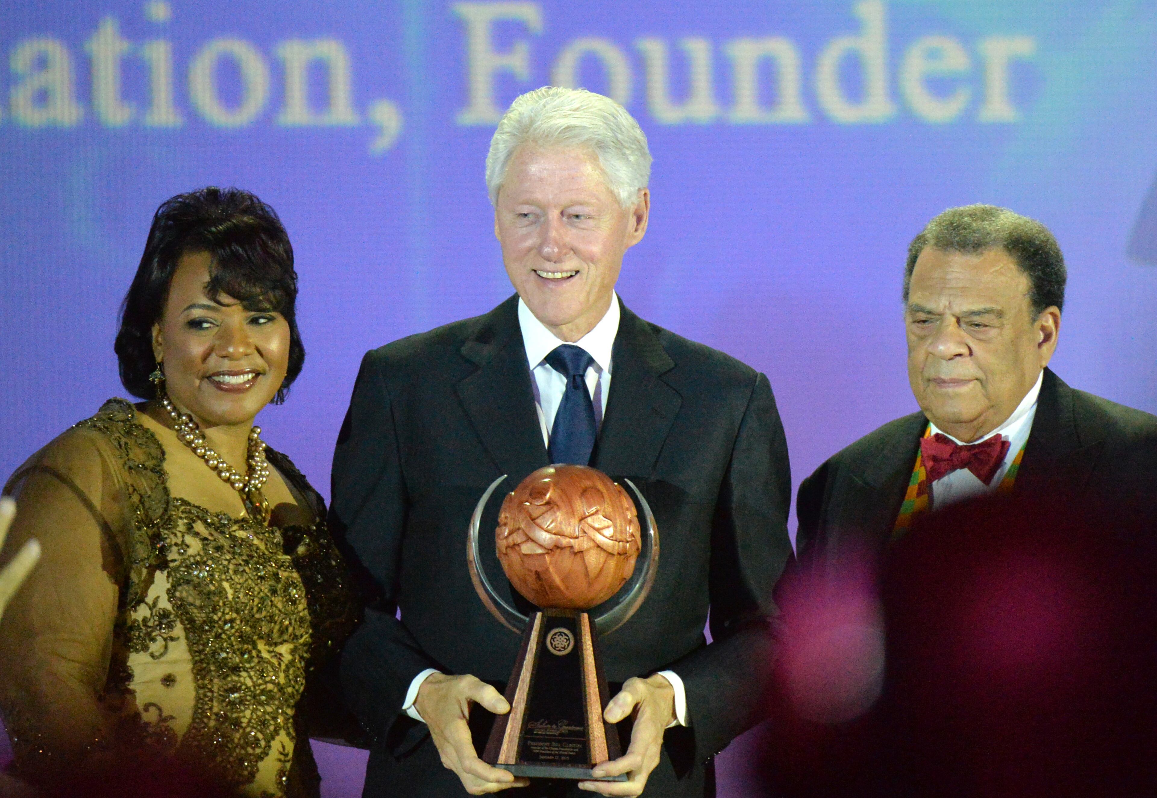 January 17, 2015 Atlanta - President Bill Clinton (center) poses with Martin Luther King Jr.'s daughter Bernice King (left) and ambassador Andrew Young after president Clinton received the Salute to Greatness Award during the annual Salute to Greatness Awards Dinner at the Hyatt Regency on Saturday, January 17, 2015. HYOSUB SHIN / HSHIN@AJC.COM