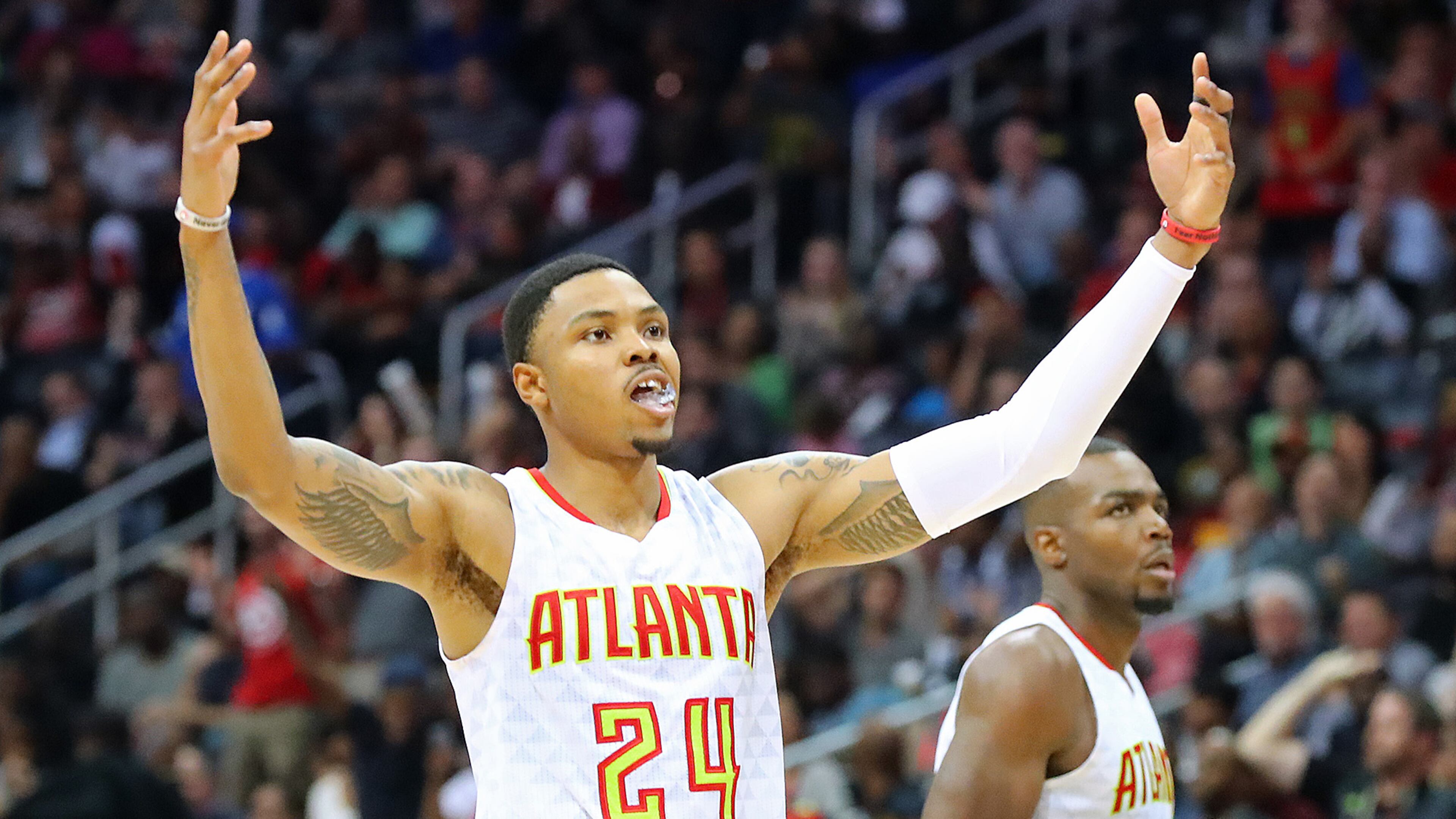 Hawks 'Kent Bazemore rallies with the crowd to celebrate their 111-101 victory over the Washington Wizards in Game 4 of the first-round NBA playoff series Monday, April 24, 2017, in Atlanta.