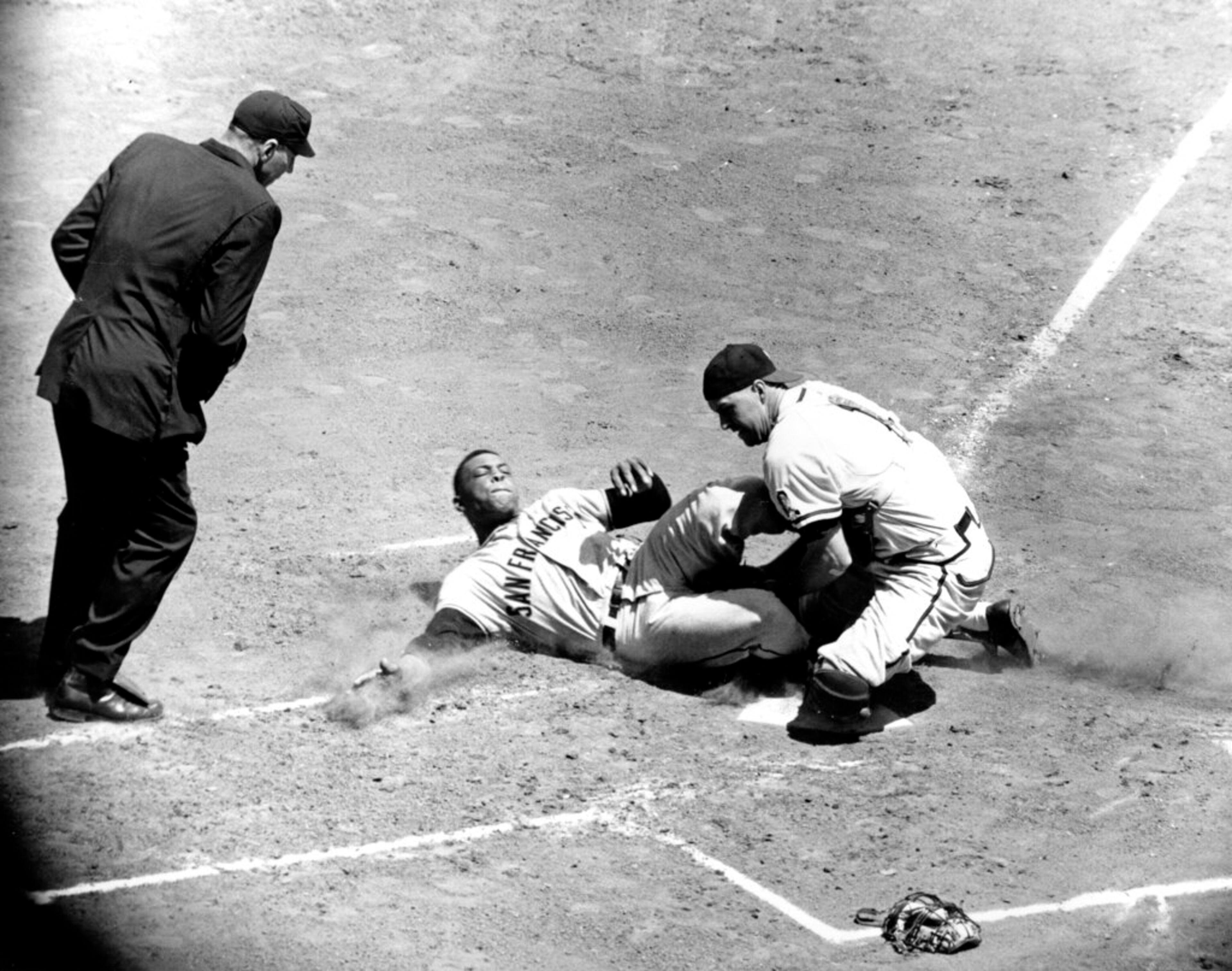 San Francisco Giants' Willie Mays is out at home plate under the tag of Del Crandall, Milwaukee Braves catcher, after trying to score from first base on Orlando Cepeda's single to right in the first inning at Milwaukee County Stadium, Wis., June 4, 1959. (AP Photo)