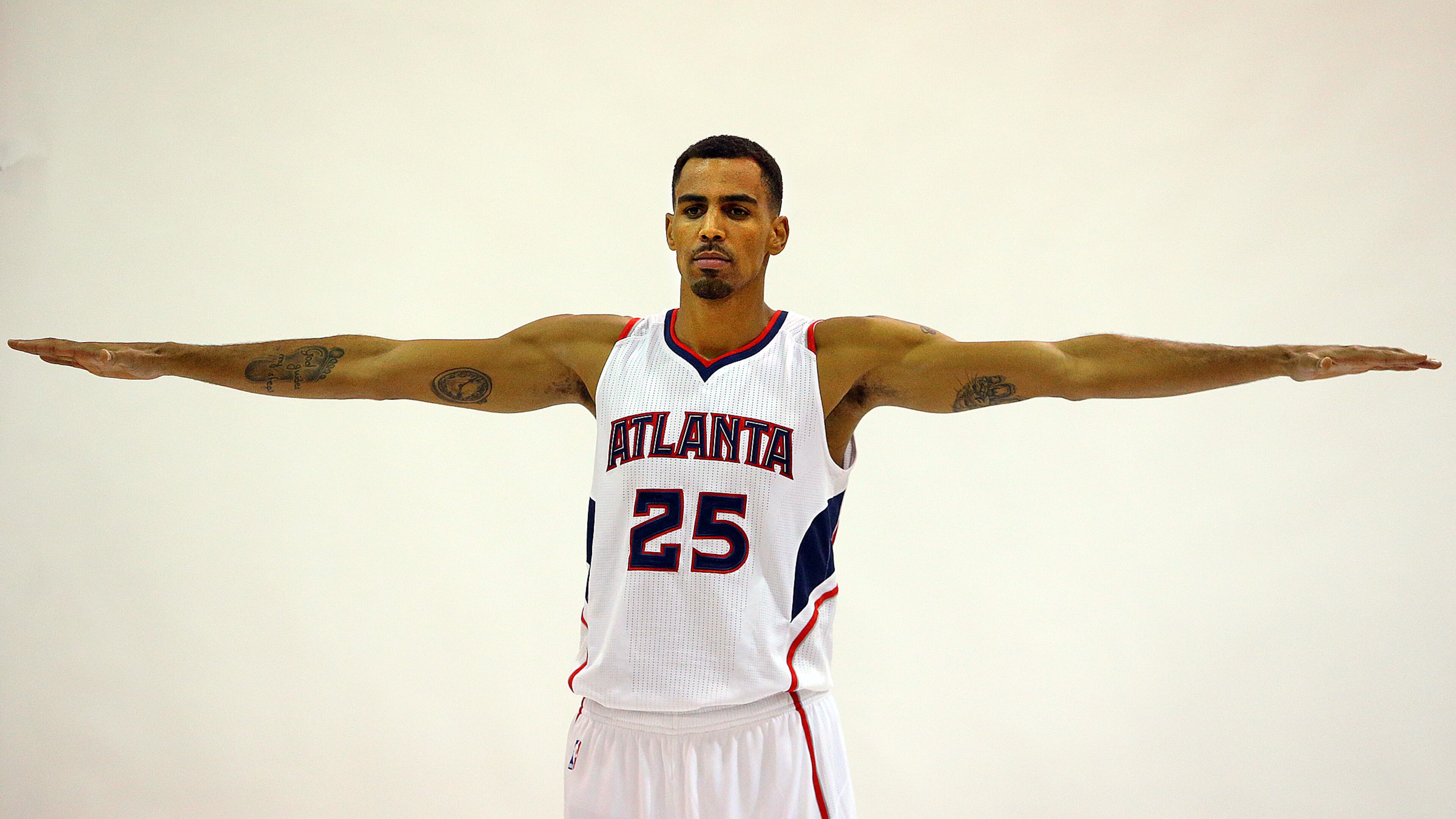092914 ATLANTA: Hawks guard Thabo Sefolosha shows off his wing span while posing for a portrait during Media Day at Philips Arena on Monday, Sept. 29, 2014, in Atlanta.