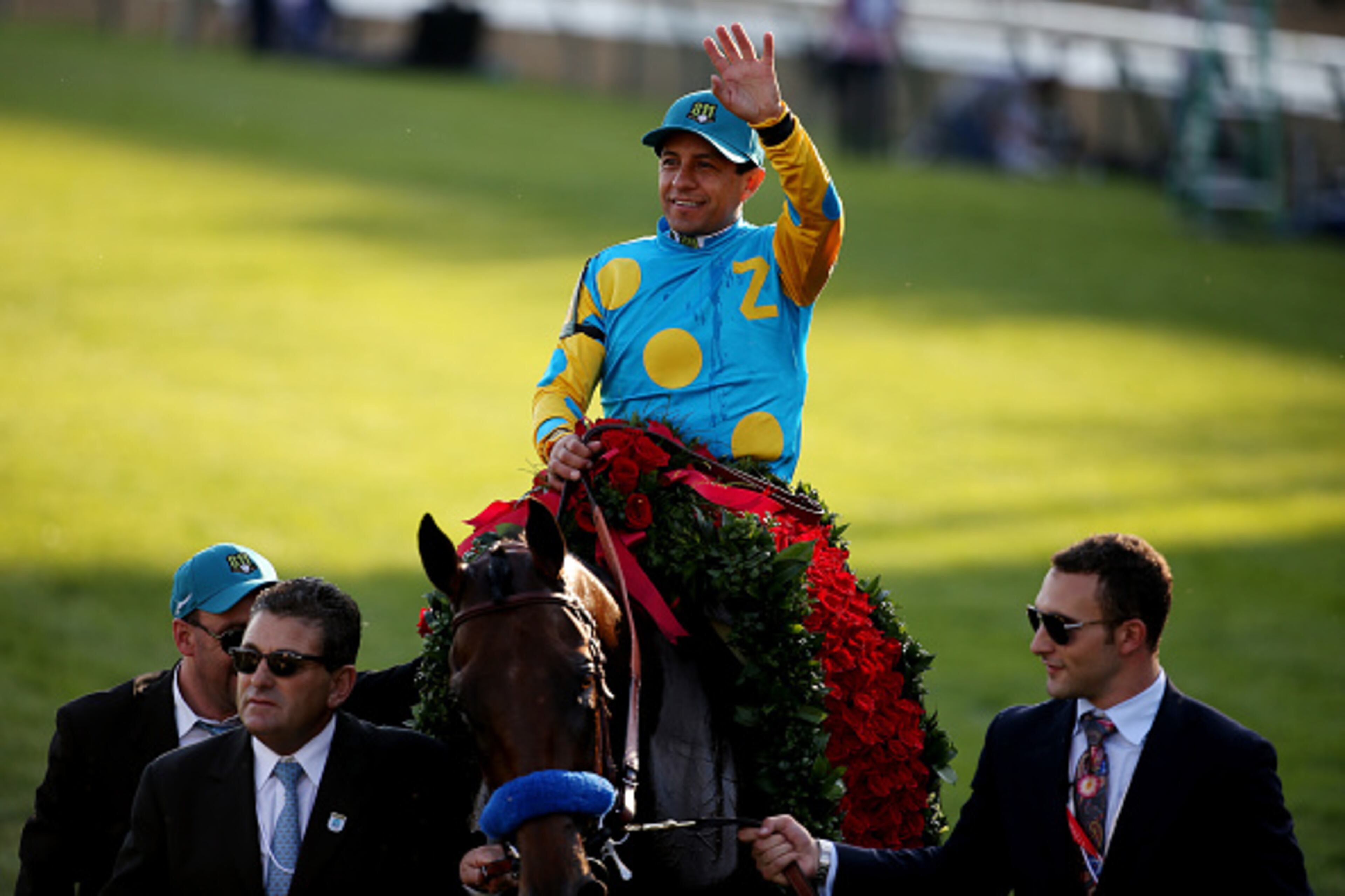 LOUISVILLE, KY - MAY 02: Jockey Victor Espinoza celebrates atop of American Pharoah #18 on his way winners circle after winning the 141st running of the Kentucky Derby at Churchill Downs on May 2, 2015 in Louisville, Kentucky. (Photo by Andy Lyons/Getty Images)