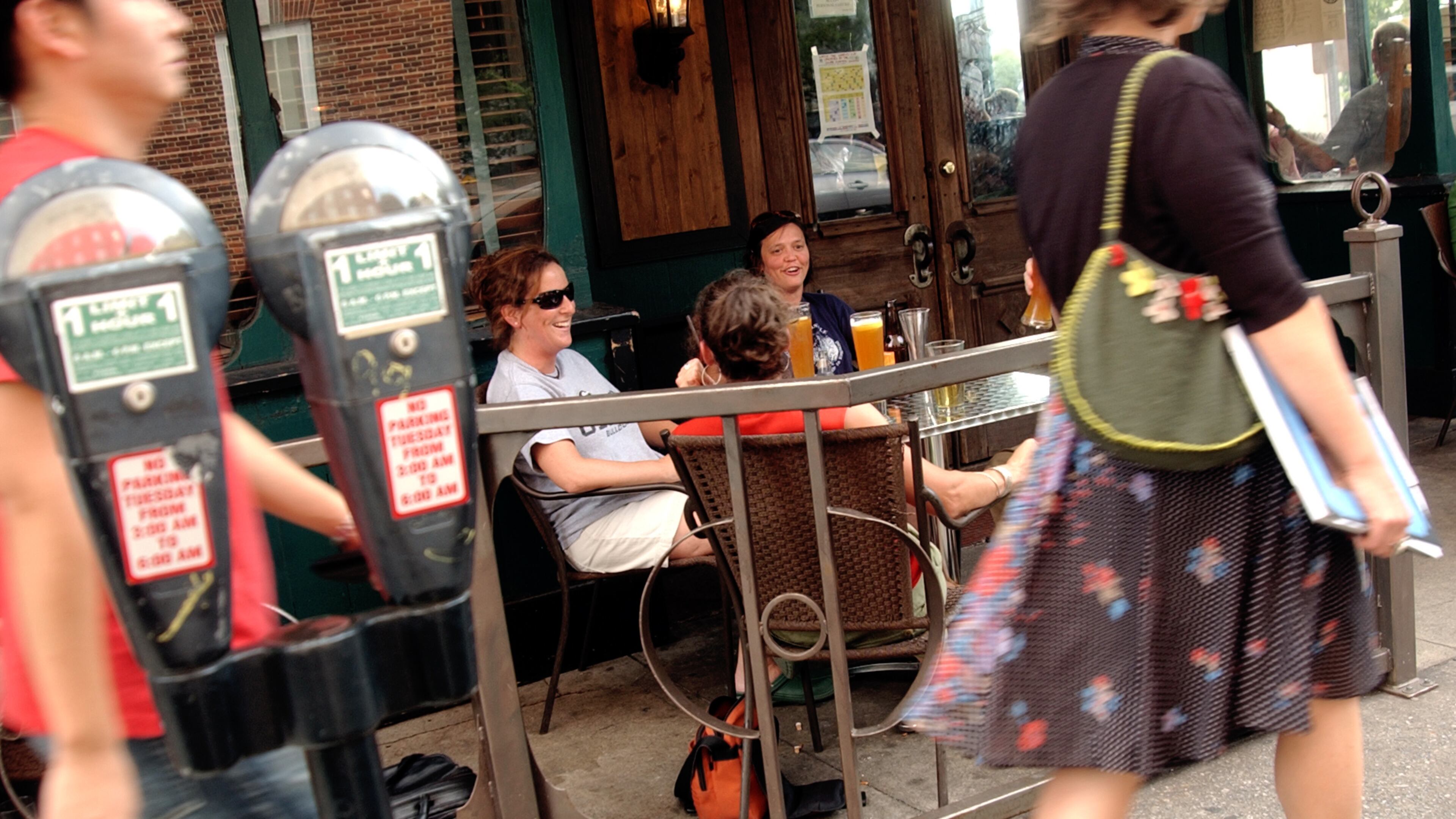 People stroll along Lumpkin Street in front of The Globe. / AJC file photo