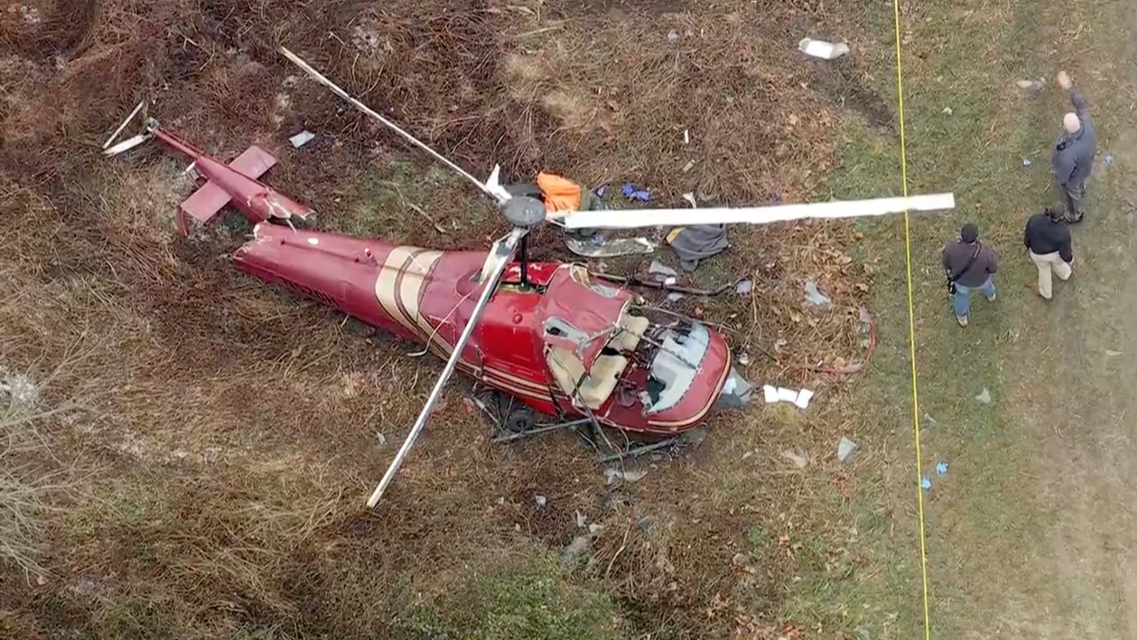 Authorities look over the scene after two helicopters crashed in Hammonton, N.J., on Sunday, Dec. 28, 2025. (WPVI-TV/6ABC via AP)