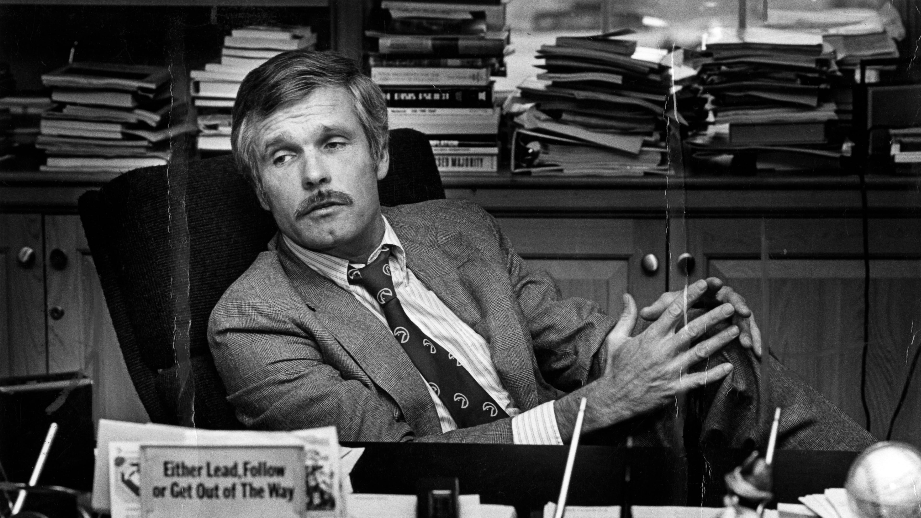 FILE - Ted Turner is seen at his desk inside the CNN Center in 1982. (Nancy Mangiafico/Atlanta Journal-Constitution via AP, File)