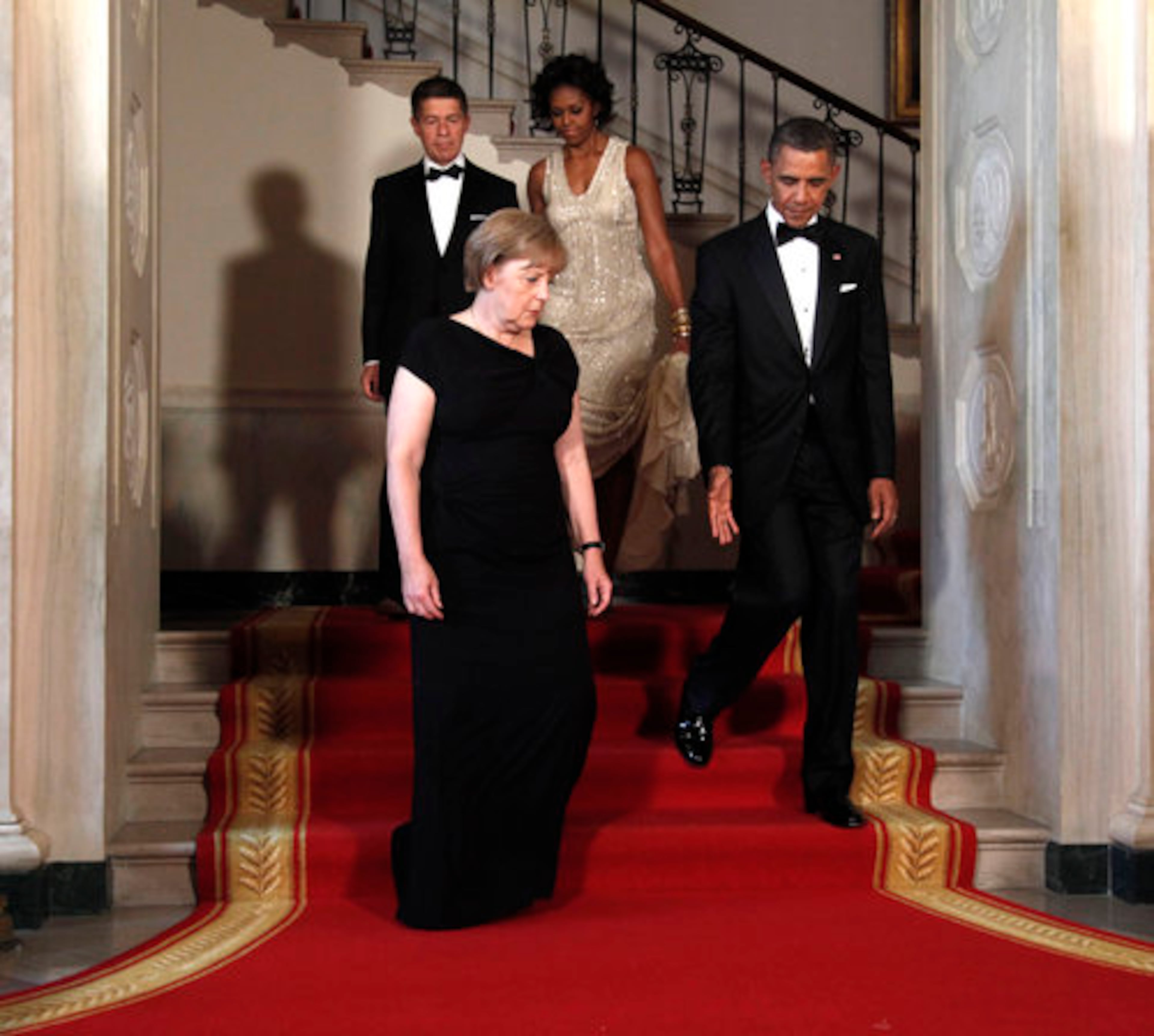 First lady Michelle Obama and President Barack Obama with with German Chancellor Angela Merkel and her husband Joachim Sauer at the Grand Staircase as at the White House.