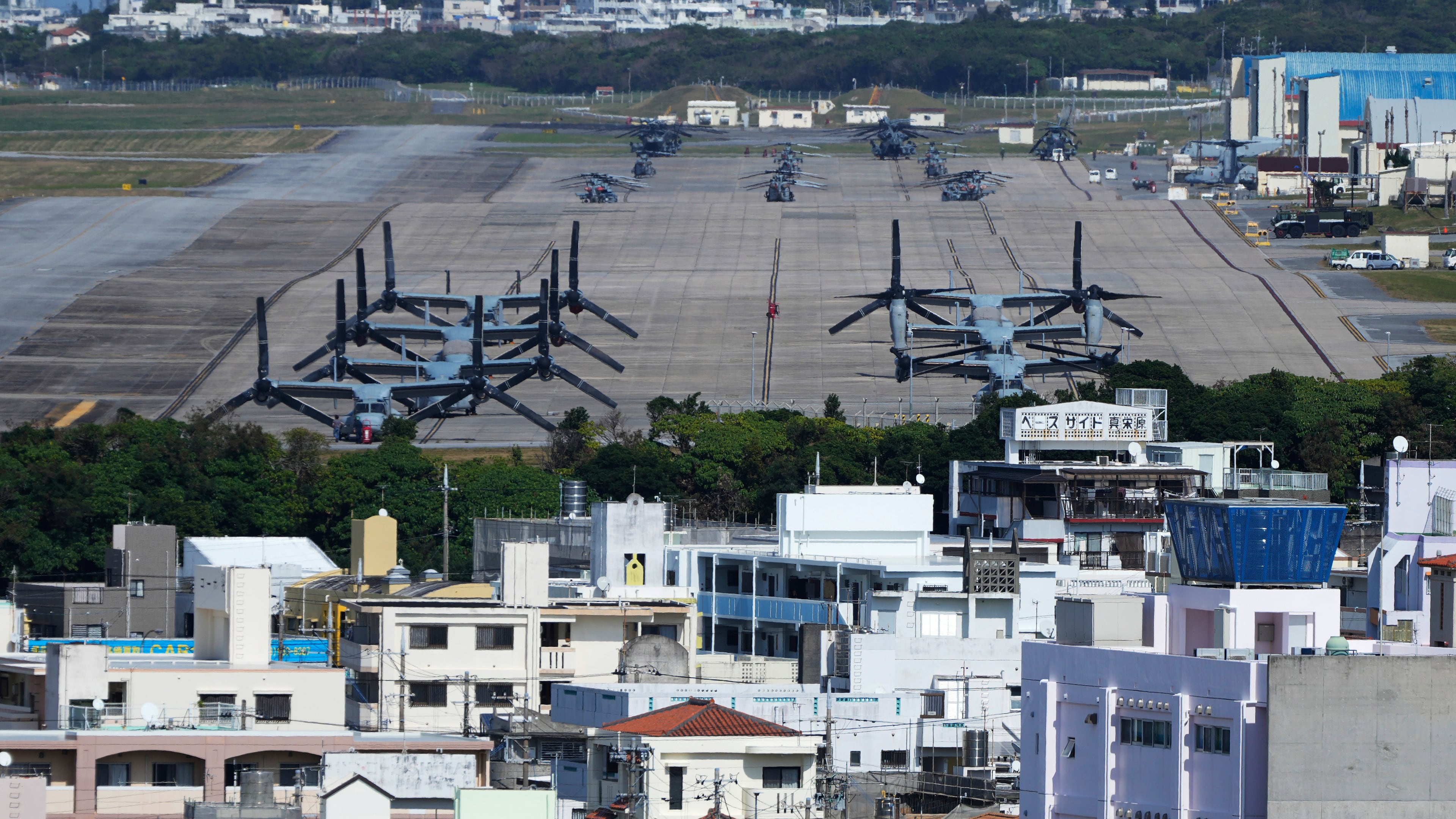FILE - U.S. MV-22 Osprey transport aircraft are parked at the U.S. Marine Corps Air Station Futenma in Ginowan, on the main island of the Okinawa archipelago, southern Japan, Tuesday, Feb. 18, 2025. (AP Photo/Hiro Komae, File)