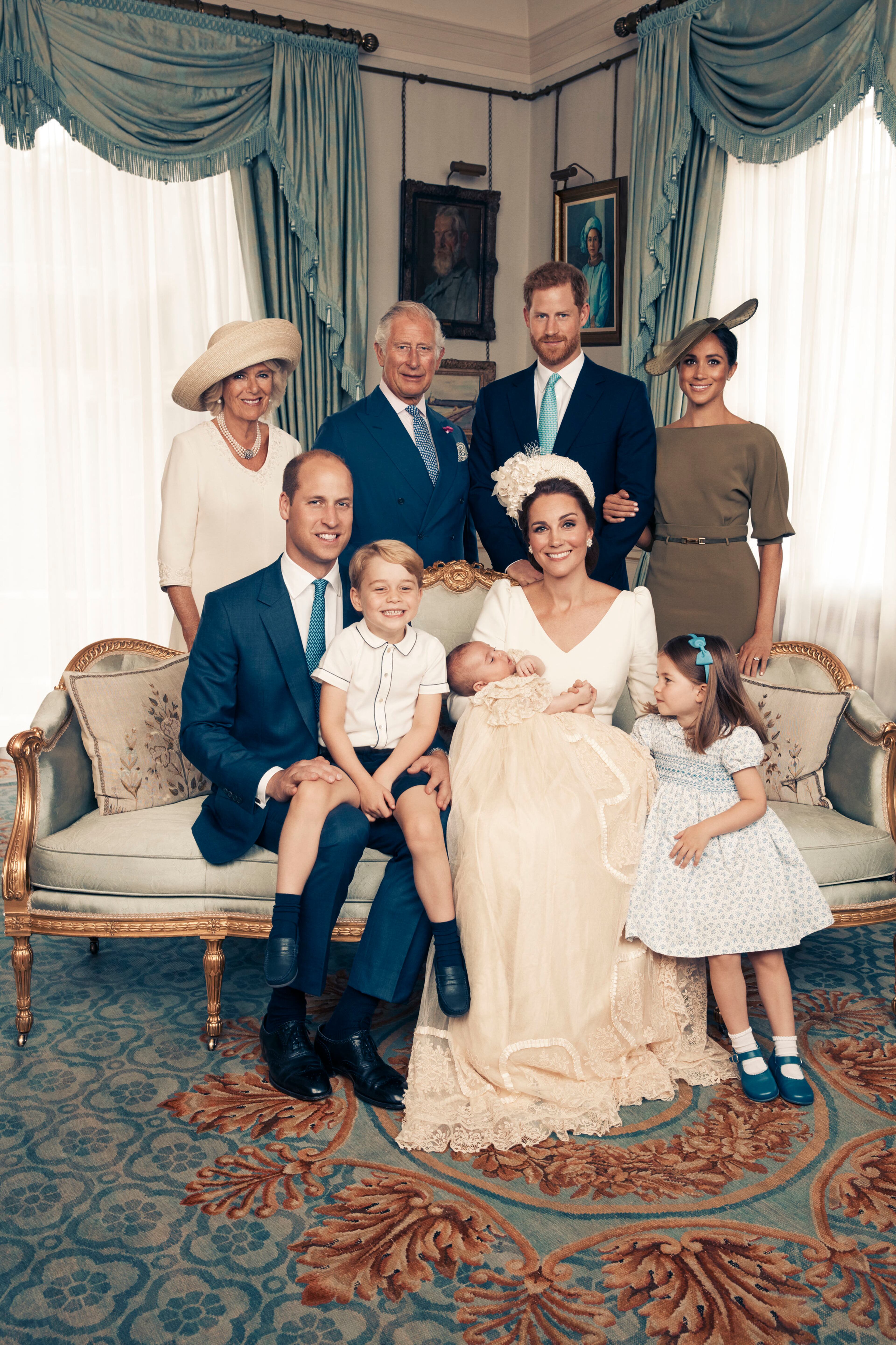 This Monday, July 9, 2018, photo provided by the Duke and Duchess of Cambridge shows an official photograph to mark the christening of Prince Louis at Clarence House, following Prince Louis' baptism, in London. Seated, left to right: Prince William, The Duke of Cambridge; Prince George; Prince Louis; Kate, the Duchess of Cambridge; and Princess Charlotte. Standing, left to right: Camilla, The Duchess of Cornwall; Prince Charles, the Prince of Wales; Prince Harry, the Duke of Sussex; and wife Megan, the Duchess of Sussex. (Matt Holyoak/Camera Press/Duke and Duchess of Cambridge via AP)