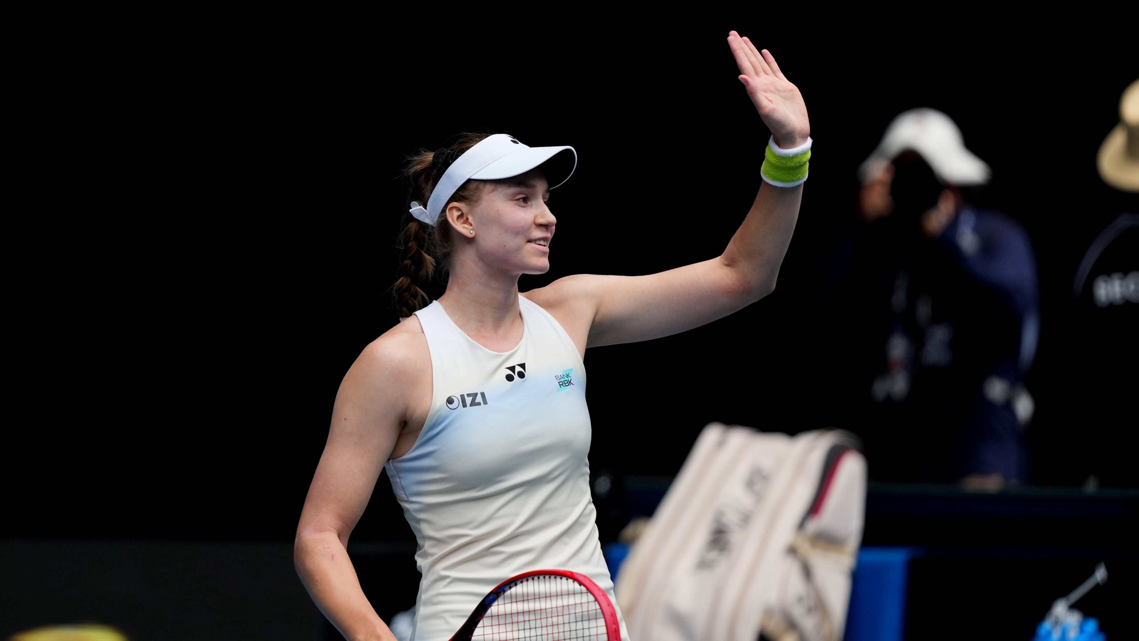 Elena Rybakina of Kazakhstan waves after defeating Iga Swiatek of Poland in their quarterfinal match at the Australian Open tennis championship in Melbourne, Australia, Wednesday, Jan. 28, 2026. (AP Photo/Dar Yasin)