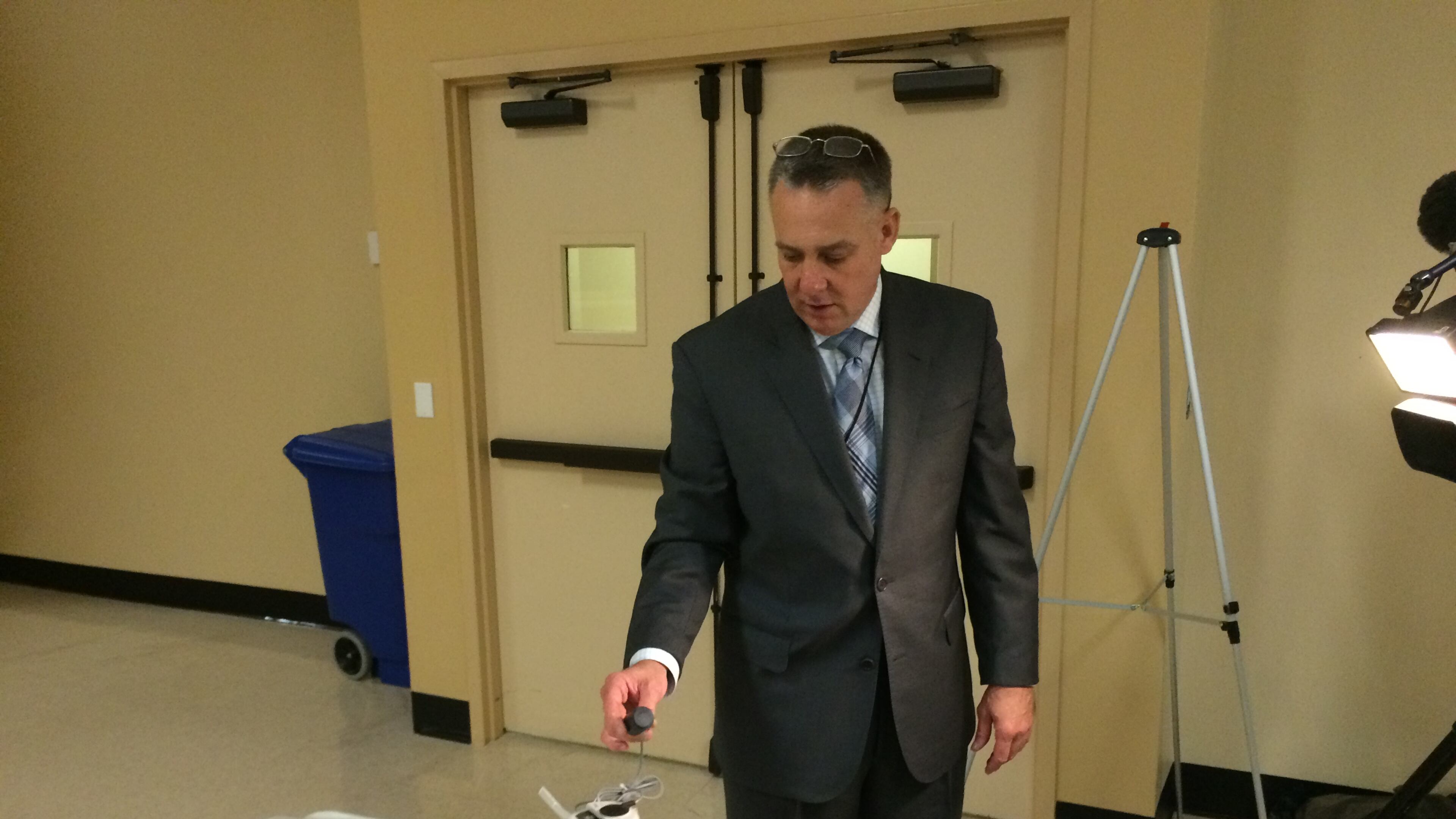 DeKalb Director of Watershed Management Scott Towler shows the county’s new smart water meters Tuesday. These meters will be installed across the county and transmit water usage information as part of an effort to improve water billing accuracy. (MARK NIESSE / MARK.NIESSE@AJC.COM)