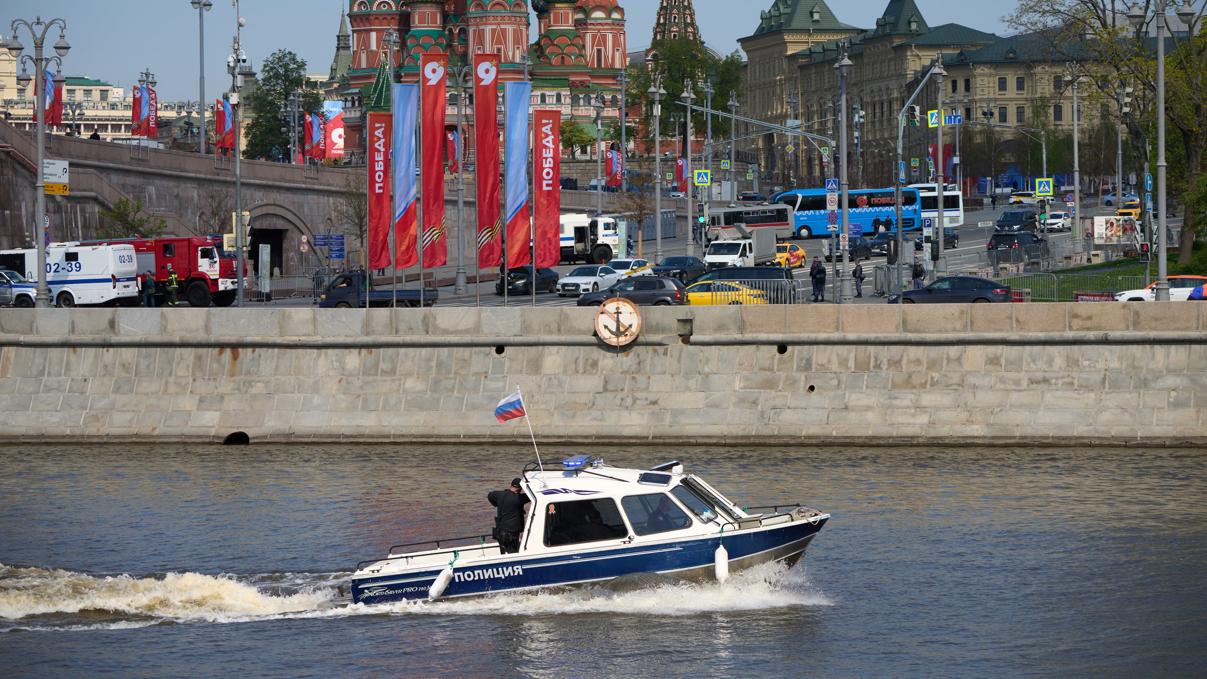 A police boat patrol the waters of the Moskva River near Red Square decorated for the celebrations of the 81st anniversary of the Soviet Union's victory over Nazi Germany at World War II during the Victory Day military parade rehearsal in Moscow, Russia, Thursday, May 7, 2026, backdropped by the St. Basil's Cathedral. (AP Photo/Alexander Zemlianichenko)