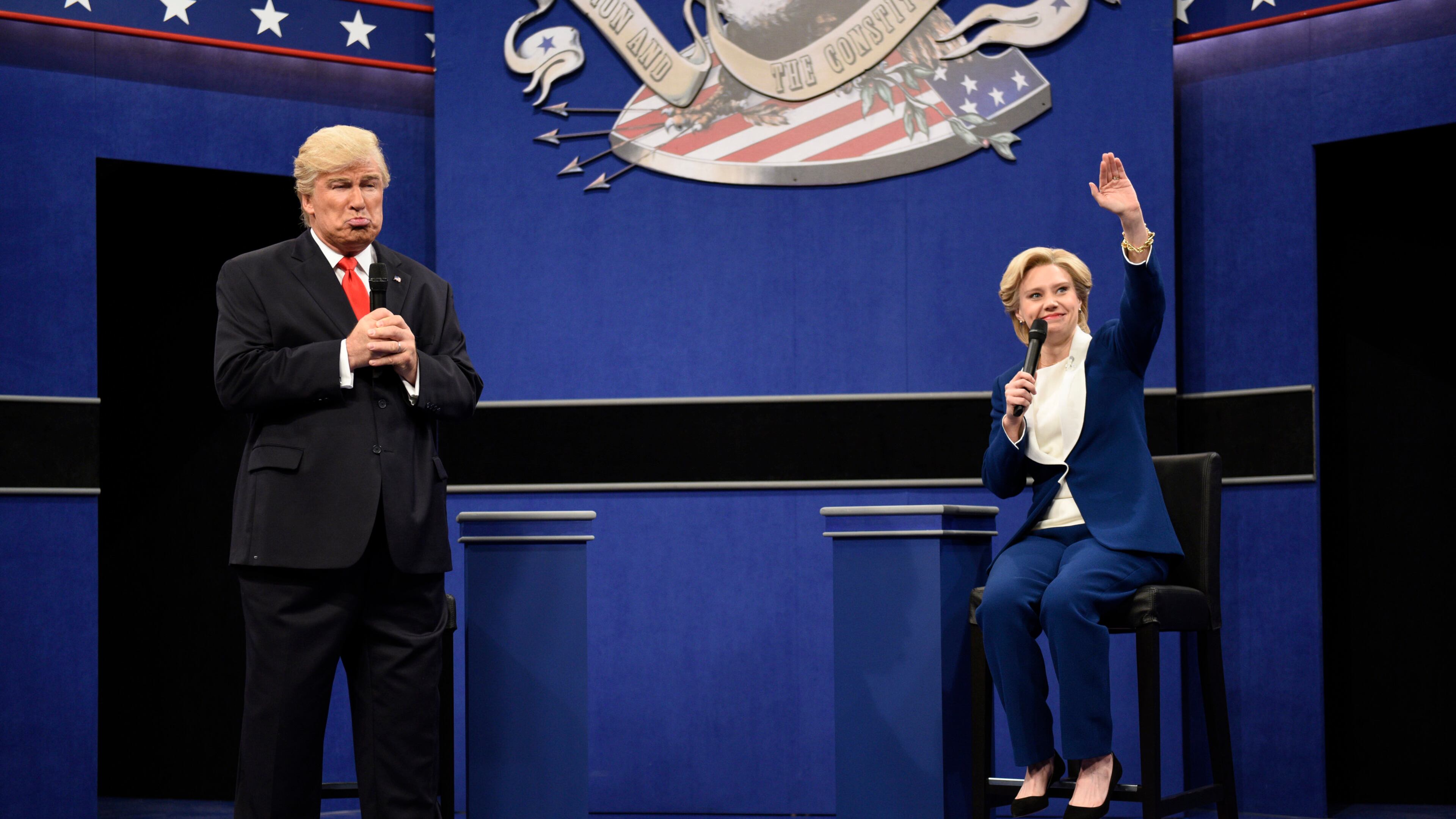 In this Oct. 15, 2016 photo provided by NBC, Alec Baldwin, left, as Republican presidential candidate, Donald Trump, and Kate McKinnon, as Democratic presidential candidate, Hillary Clinton, perform during the during the "Debate Cold Open" sketch. Republican presidential candidate Donald Trump tweeted early Sunday morning, Oct. 16 that the show’s skit depicting him this week was a “hit job.” Trump went on to write that it’s “time to retire” the show, calling it “boring and unfunny” and adding that Alec Baldwin’s portrayal of him “stinks.”(Will Heath/NBC via AP)