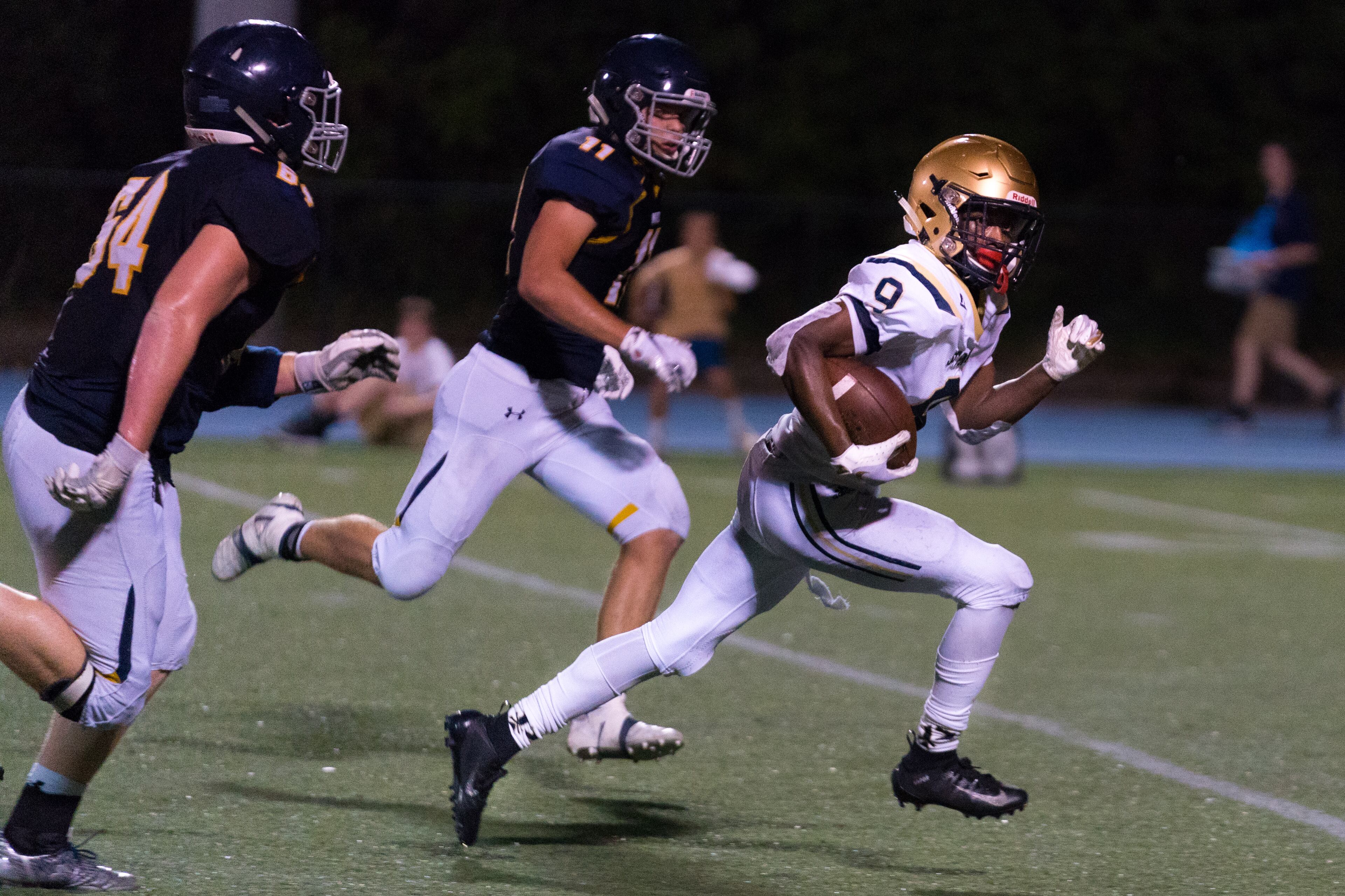 St. Pius running back Jason Jones (9) breaks free against the Marist defense in the second half of Friday's game. (Drew Dinwiddie/Special)