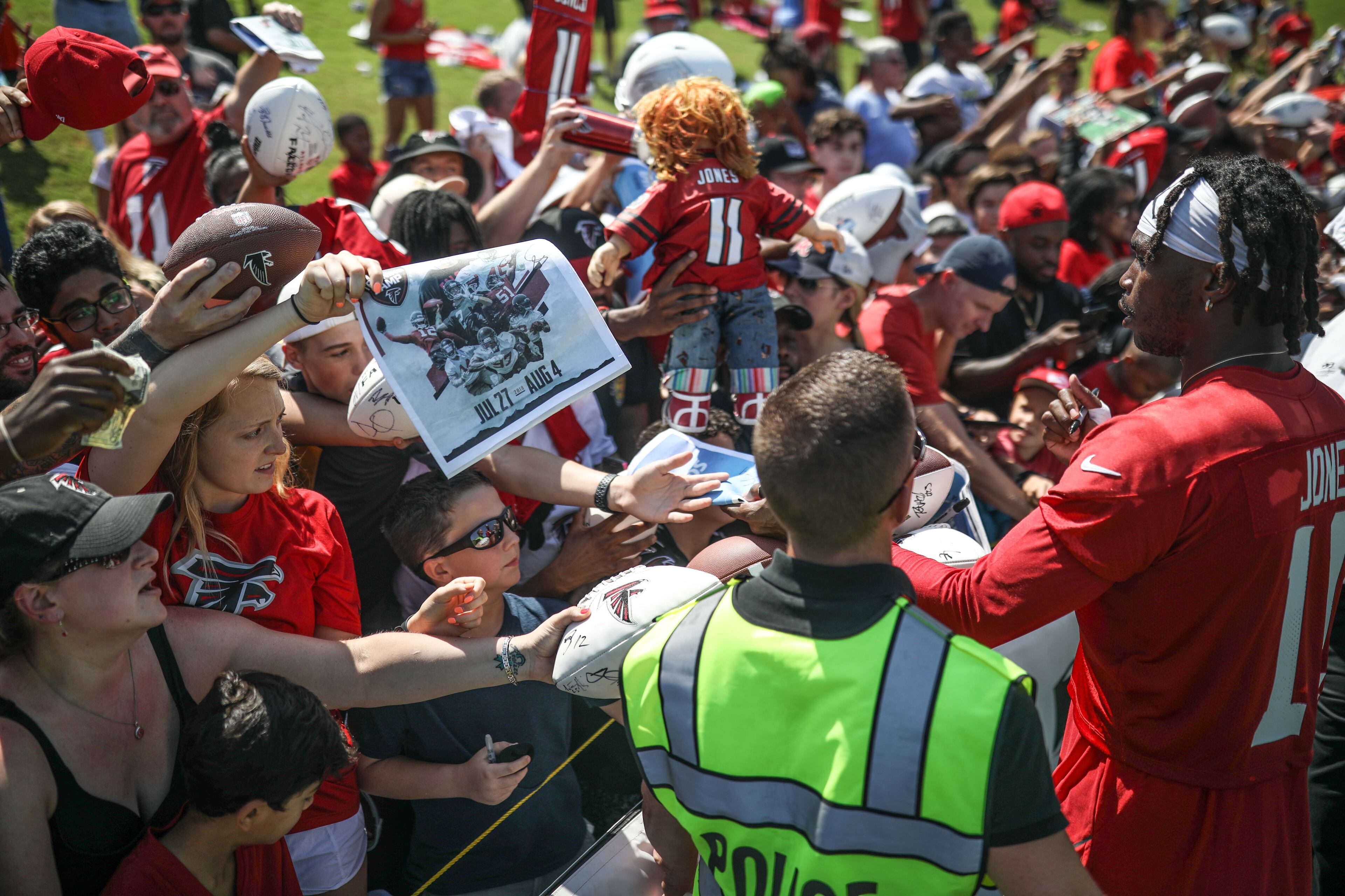 Wide receiver Julio Jones signs autographs during training camp, Saturday, July 28, 2018, in Flowery Branch, Ga. BRANDEN CAMP/SPECIAL