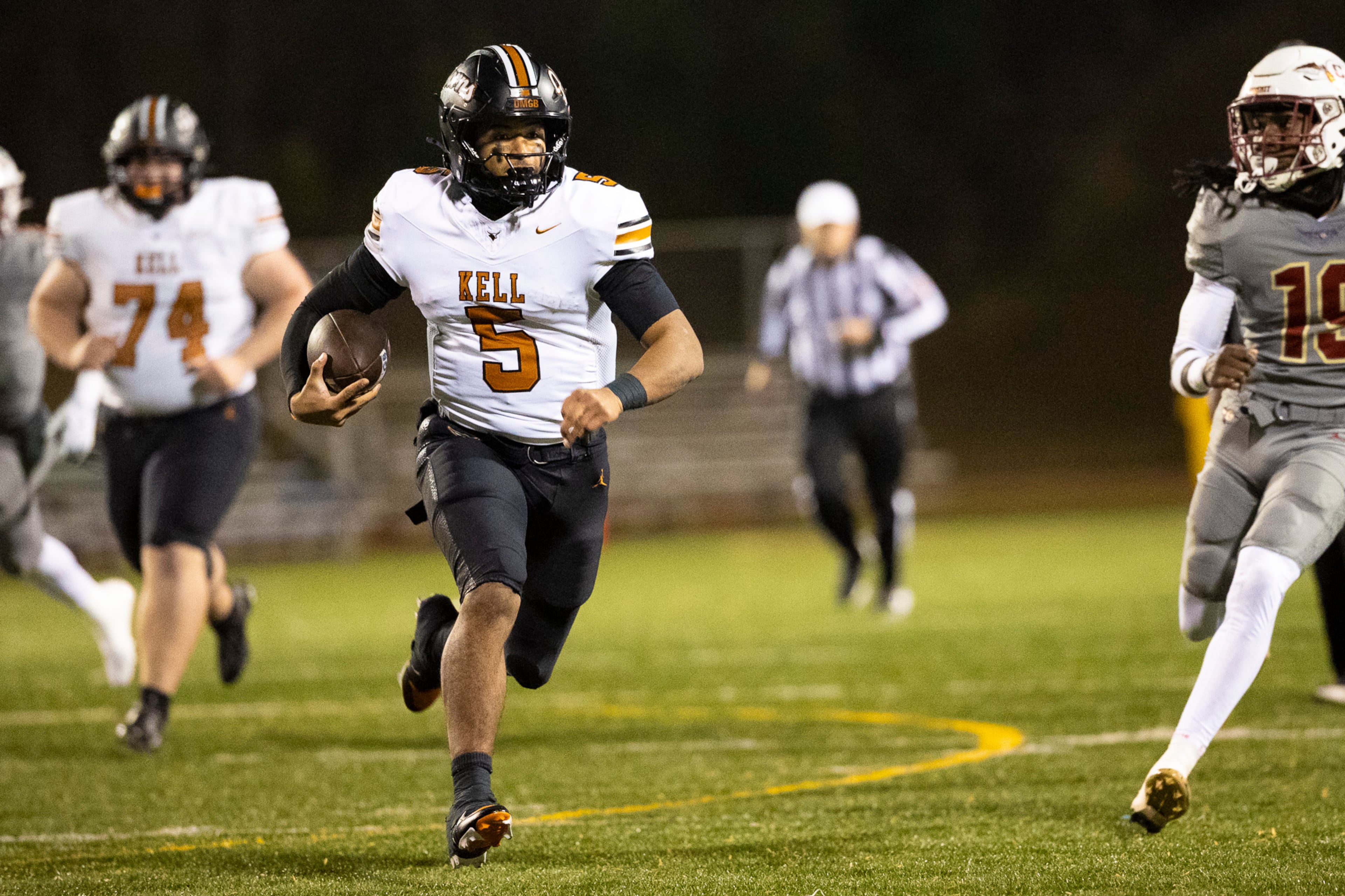 Kell quarterback Kaleb Narcisse runs with the ball during the first half of the Class 4A semifinal against Creekside on Friday, Dec. 5, 2025, at Creekside High School in Fairburn. (Oscar Guevara Saenz for the AJC)
