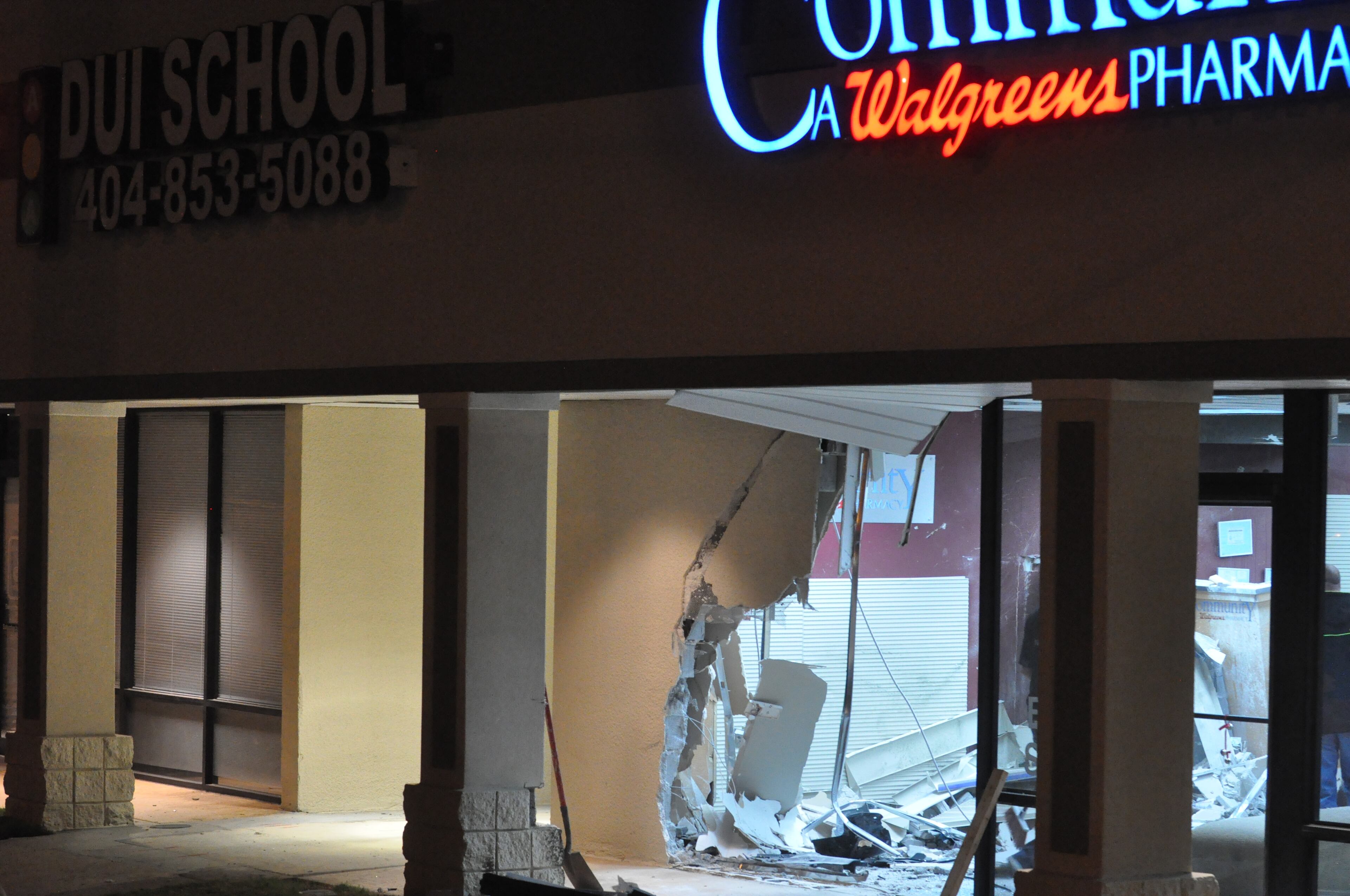 An allegedly drunk driver crashed his car through the front of a northeast Atlanta pharmacy early Friday, then walked away from the wreckage to a nearby bar, where he continued drinking, police said.