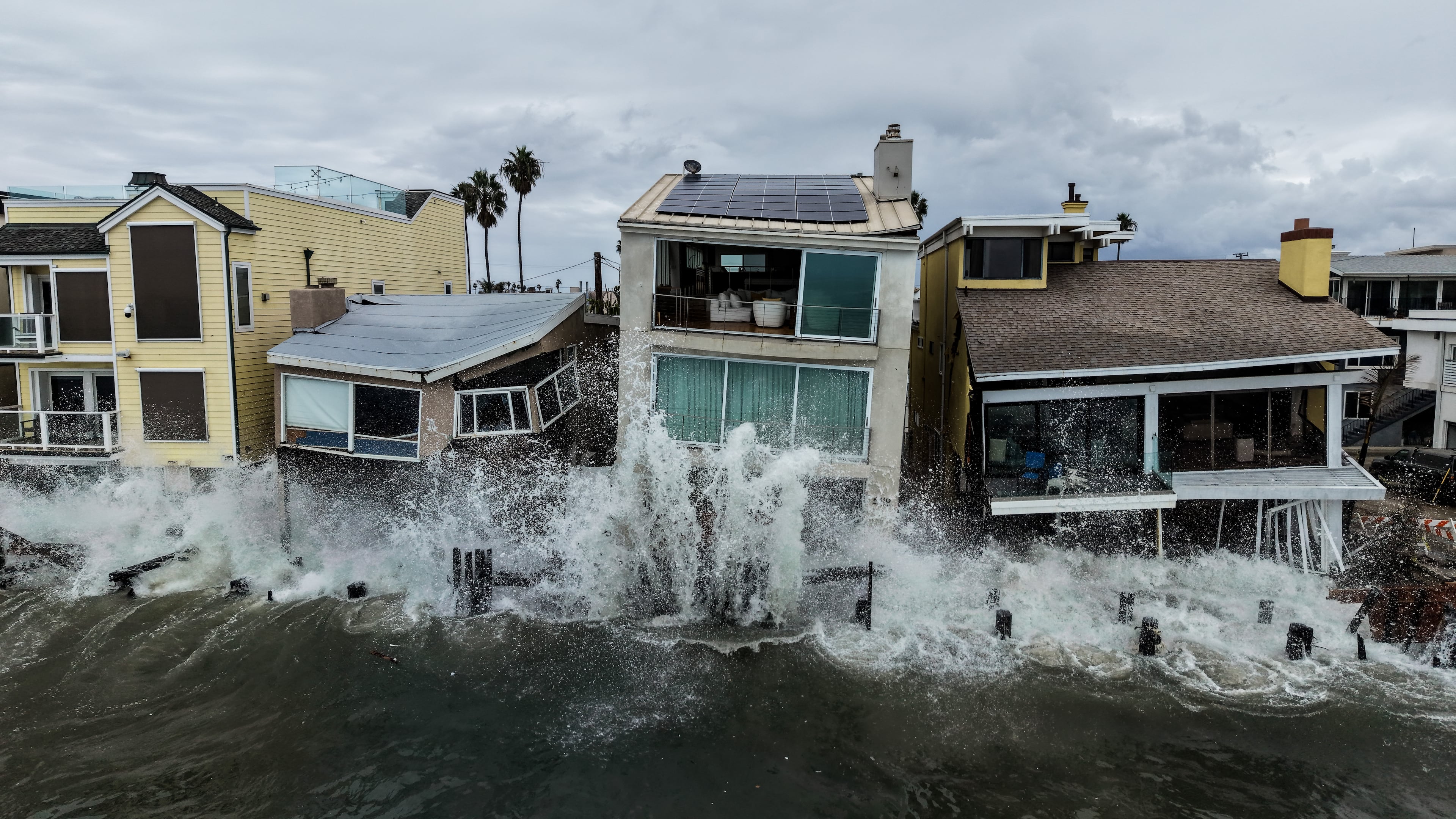 Waves from post-tropical cyclone Rachel crash into beachfront homes in Long Beach, Calif., Monday, Oct. 12, 2026. (AP Photo/Jae C. Hong)