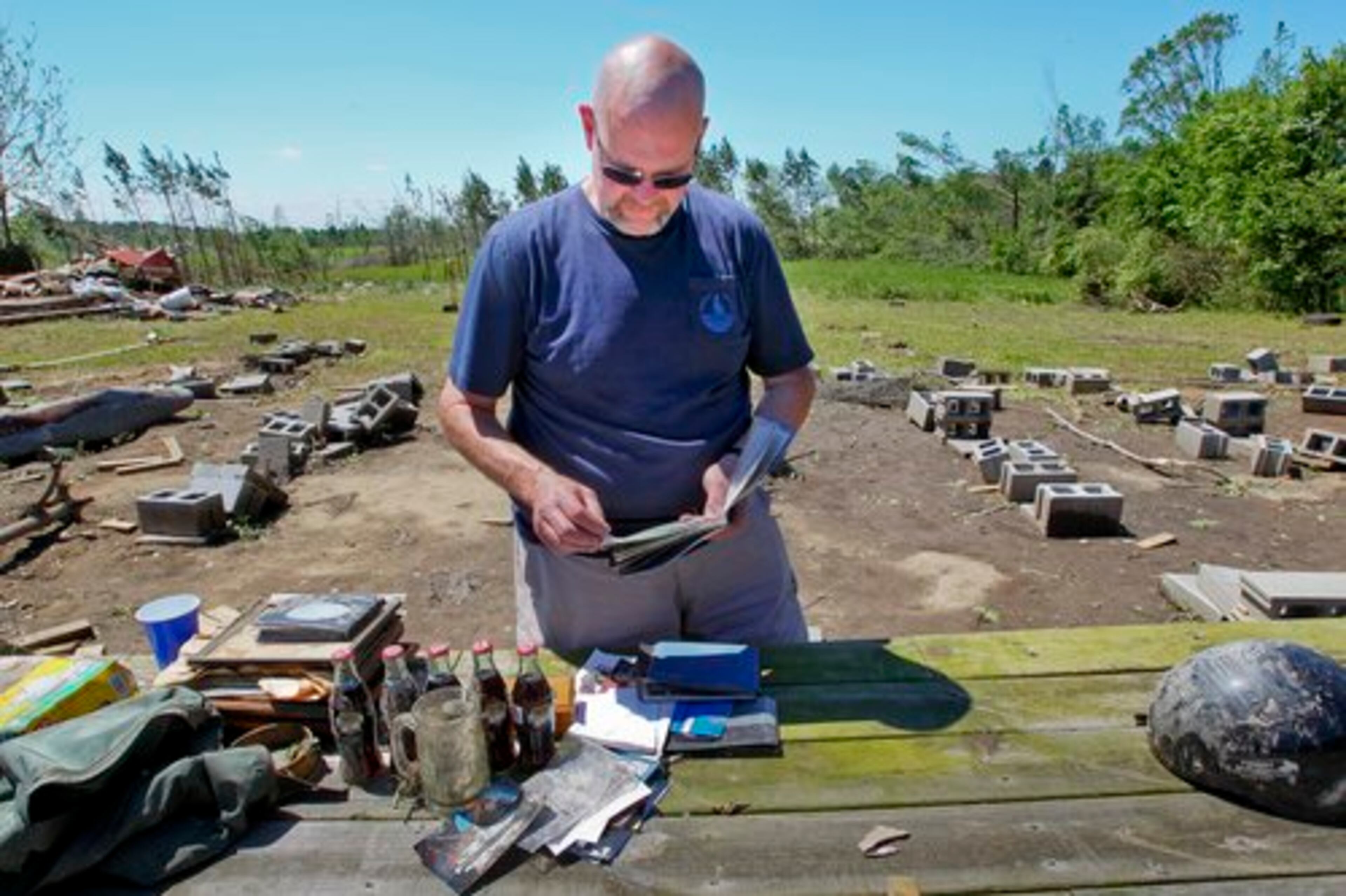 April 2011: Kirk Green looks over the site in Brooks where his brother, Charlie Green, perished along with his caretaker, Jamie White, during the overnight storms.