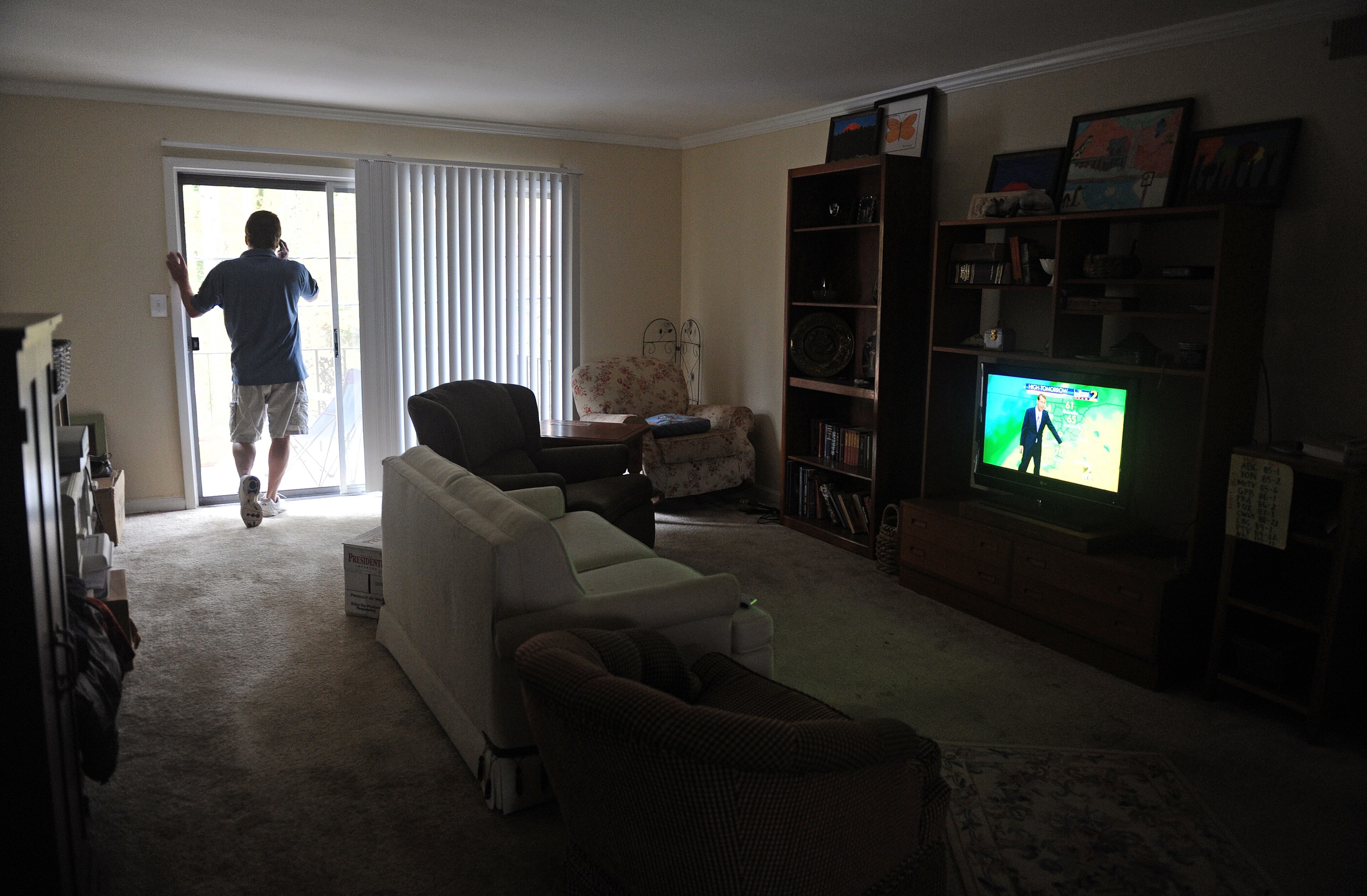 From the apartment where the family moved after their home was foreclosed, Greg speaks with his sister on the phone, telling her about his family’s upcoming move to a rental in Alpharetta. Greg said the loss of his job and income shattered his ego.