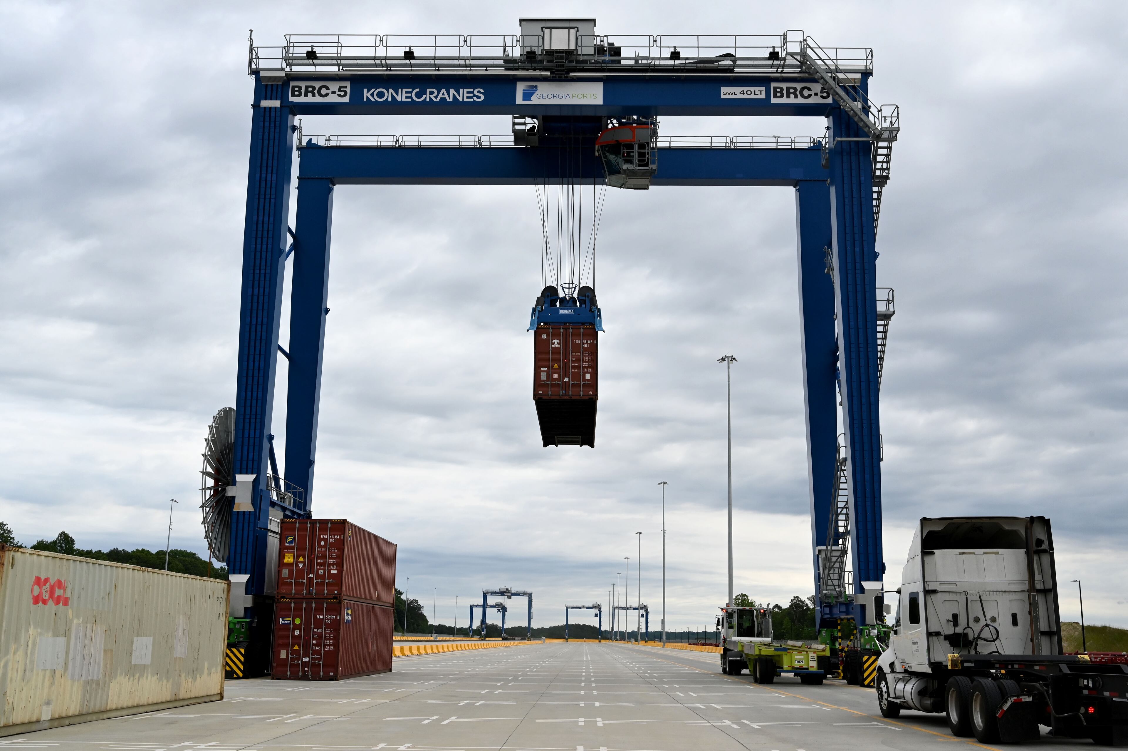 A crane moves a shipping container at a new $134 million inland port on Tuesday (Hyosub Shin/AJC).